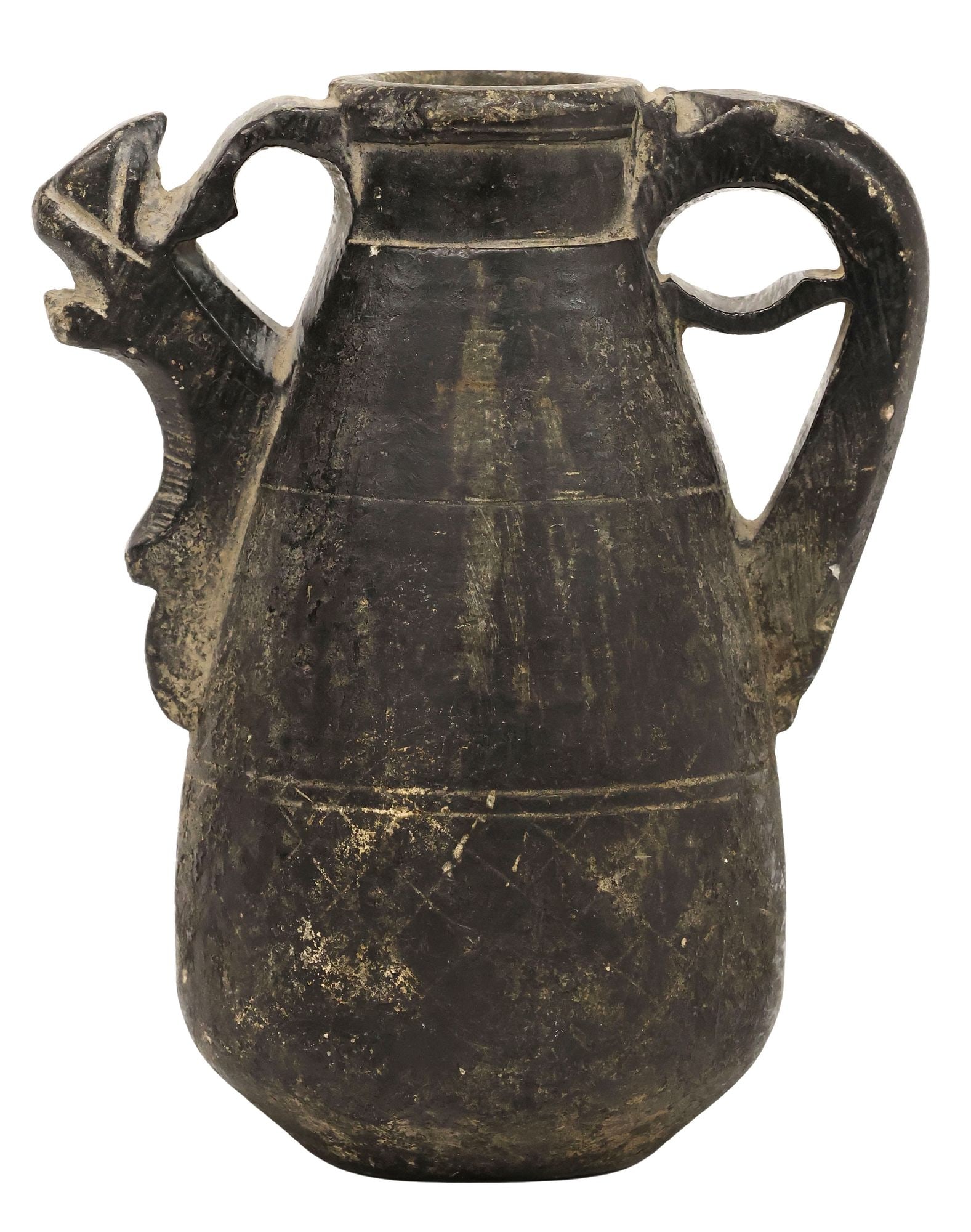 CENTRAL ASIAN CARVED BLACK STONE PITCHER W/ ZOOMORPHIC SPOUT: Central Asian stone pitcher, possibly Persian or Afghan, vasiform vessel carved from a single piece of stone, equipped with pierced handle and zoomorphic spout, lower body with worn register of incise