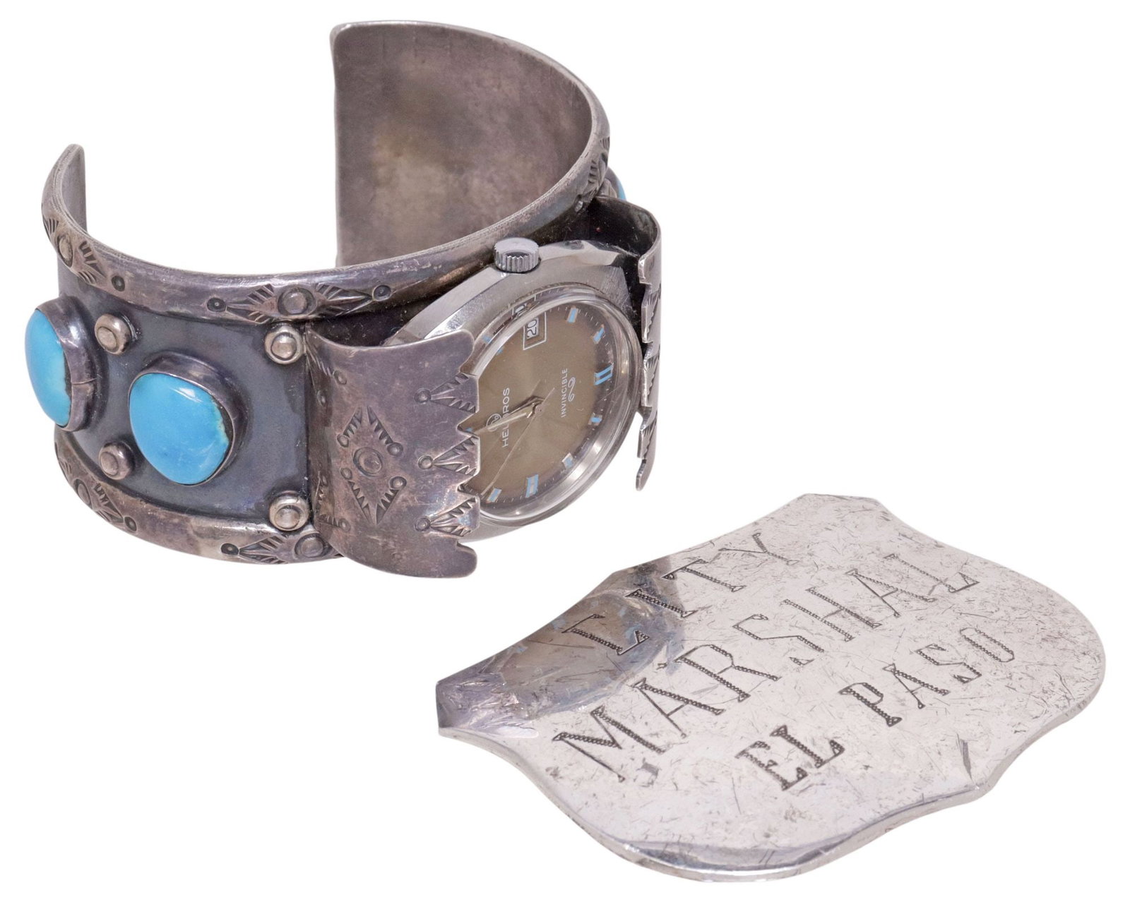 (2) NATIVE AMERICAN SILVER WATCH CUFF & FRANKLING MINT STERLING REPLICA BADGE: (lot of 2) Native American silver (content unknown) watch cuff, with four blue cabochons, geometric stampwork and beaded accents, unmarked, encasing vintage Helbros Invincible watch face with calendar
