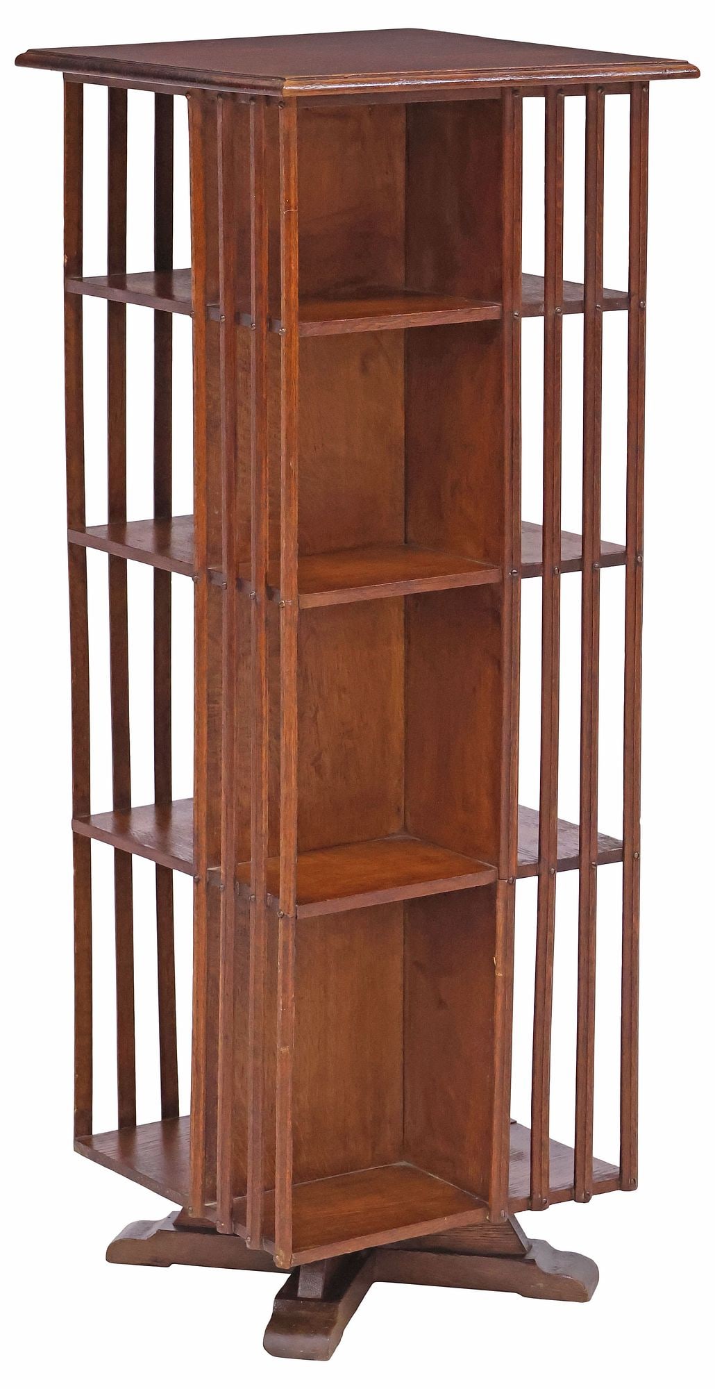 ENGLISH OAK ROTATING LIBRARY BOOKSTAND: English oak rotating library stand/ bookcase, early 20th c., having molded top, over four tiers with slatted sides, one slat with glue restorations, approx 45.5"h, 17 5/8"w, 17.5"d