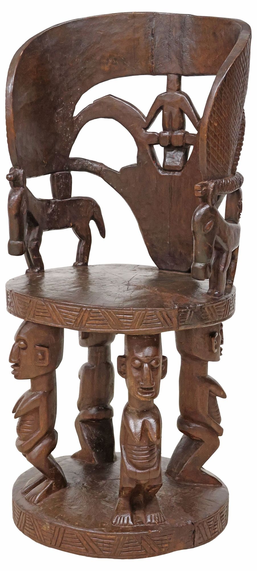 WEST AFRICAN CARVED HARDWOOD FIGURAL BARREL-BACK THRONE CHAIR: West African carved hardwood side chair, 19th c., having openwork barrel back with central carved antelope, flanked by masks, equine animal motifs, rising on figural supports, ending on circular platf