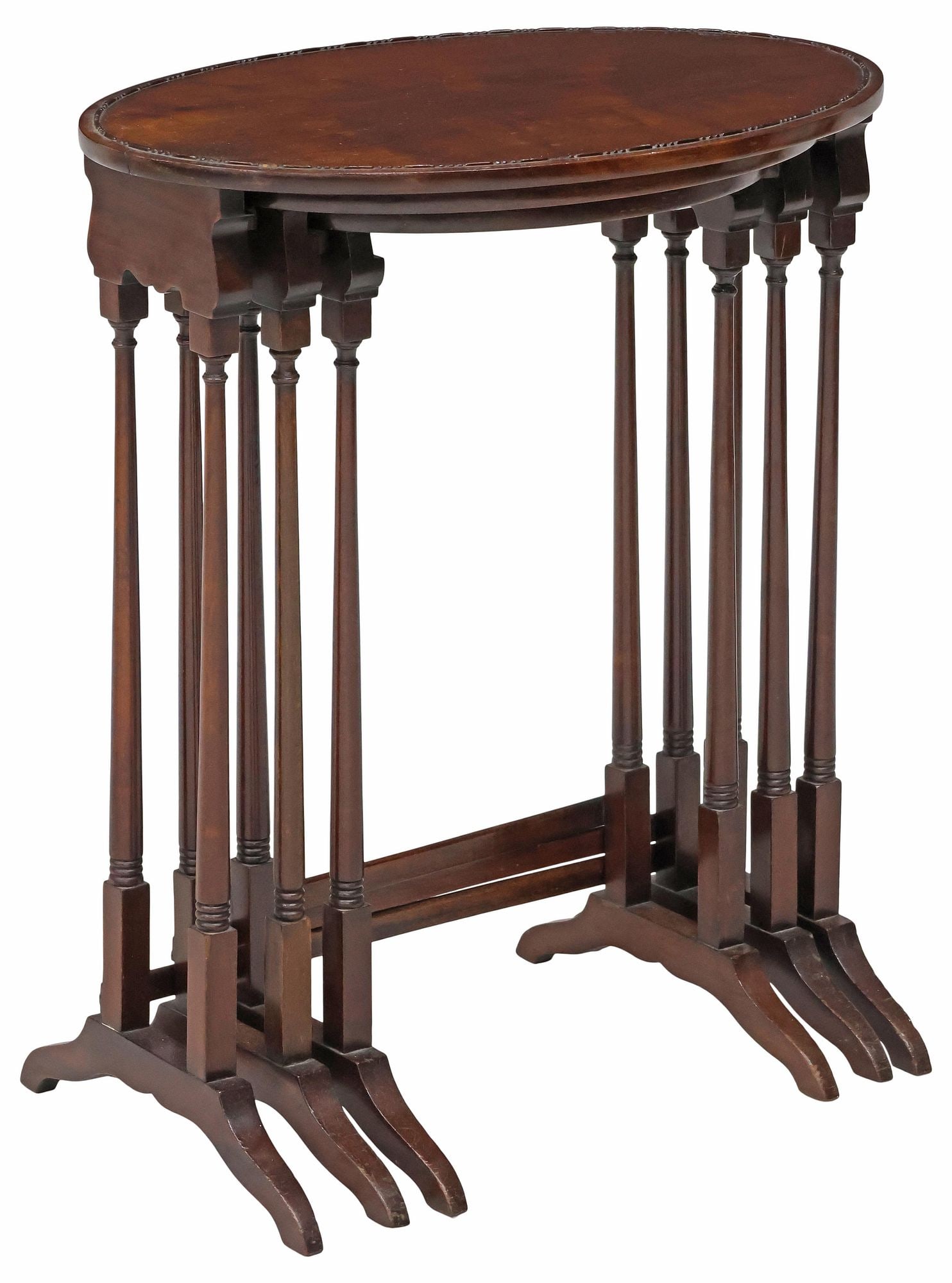 (3) ENGLISH EDWARDIAN MAHOGANY NESTING TABLES: (lot of 3) English Edwardian mahogany nesting tables, early 20th c., each with ovular top, beaded trim, rising on turned legs, ending on bridge feet, joined by H-stretcher, largest: approx 26.25"h, 22