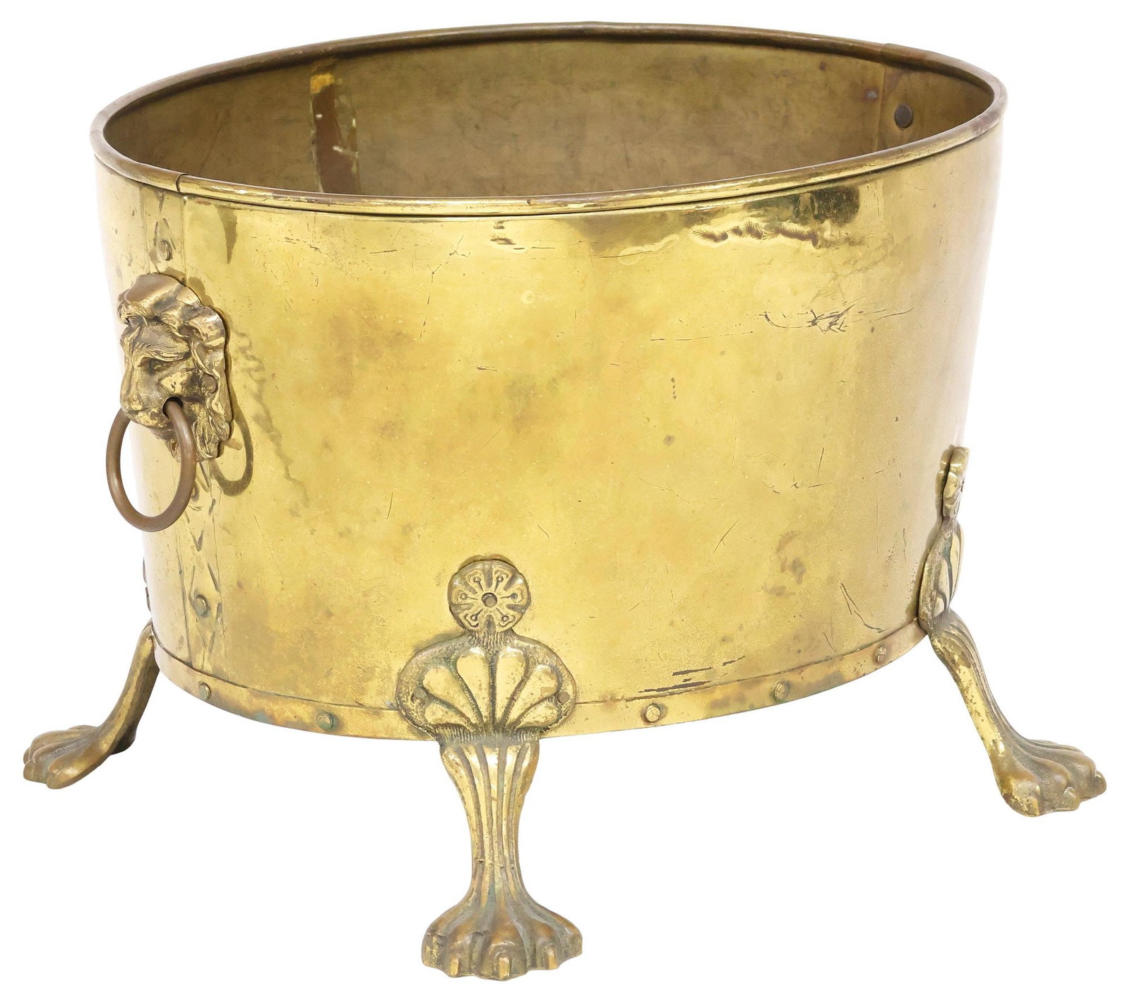 ENGLISH VICTORIAN BRASS JARDINIERE / PLANTER ON PAW FEET: English Victorian brass jardiniere/ planter, late 19th c., dual lion mask ring handles, riveted construction, ending on paw feet, approx 12.25"h, 18.25"w, 14"d, 8.75lbs