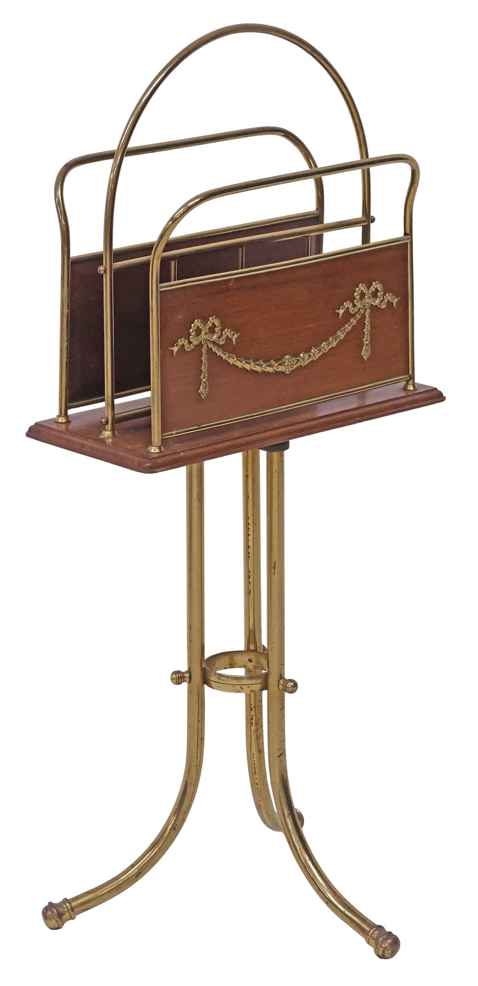 ENGLISH EDWARDIAN MAHOGANY & BRASS REVOLVING MAGAZINE RACK: English Edwardian mahogany and brass revolving magazine rack, early 20th c., having two slots with foliate swag and bow motifs, on swiveling rectangular base, rising on flared tripartite stand, approx
