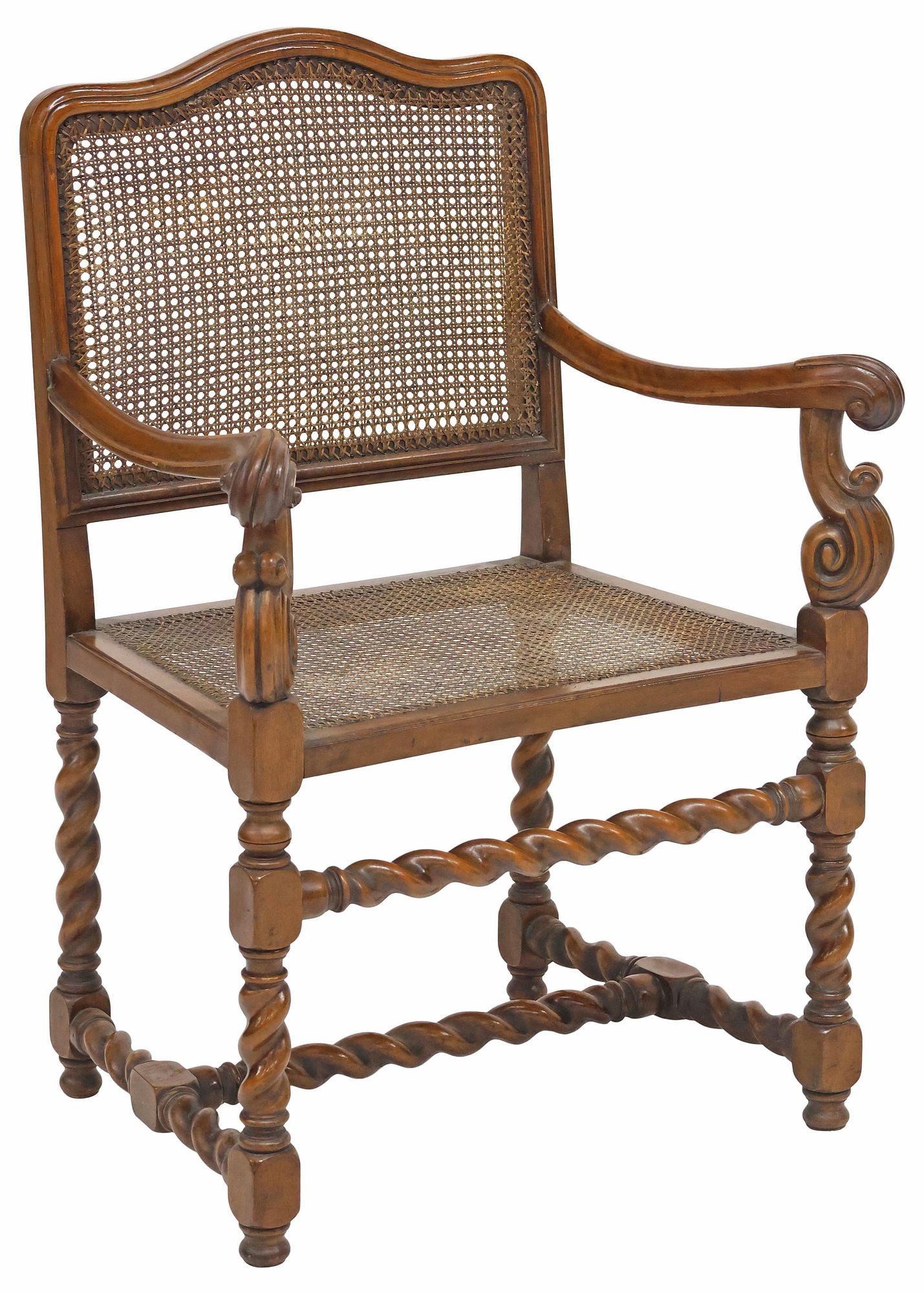 ENGLISH CANED WALNUT ARMCHAIR ON BARLEY-TWIST SUPPORTS: English Edwardian carved walnut armchair, early 20th c., with caned back and seat, scrolled armrests, over barley-twist supports and H-stretcher, rising on bun feet, approx 39"h, 27"w, 18.5"d, seat