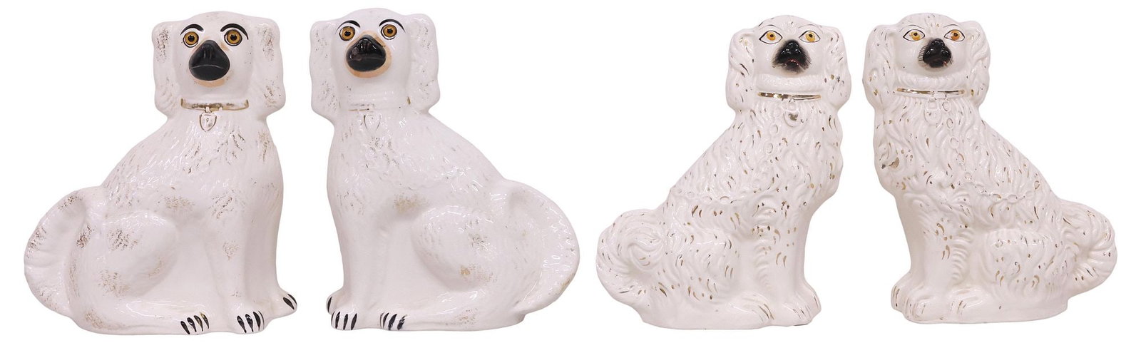 (4) ENGLISH VICTORIAN STAFFORDSHIRE MANTEL DOGS: (lot of 4) English Victorian Staffordshire mantel dogs, each modeled as a seated spaniel, with painted features, and remnants of parcel-gilt decoration, including: (pair) with inset glass eyes and lus