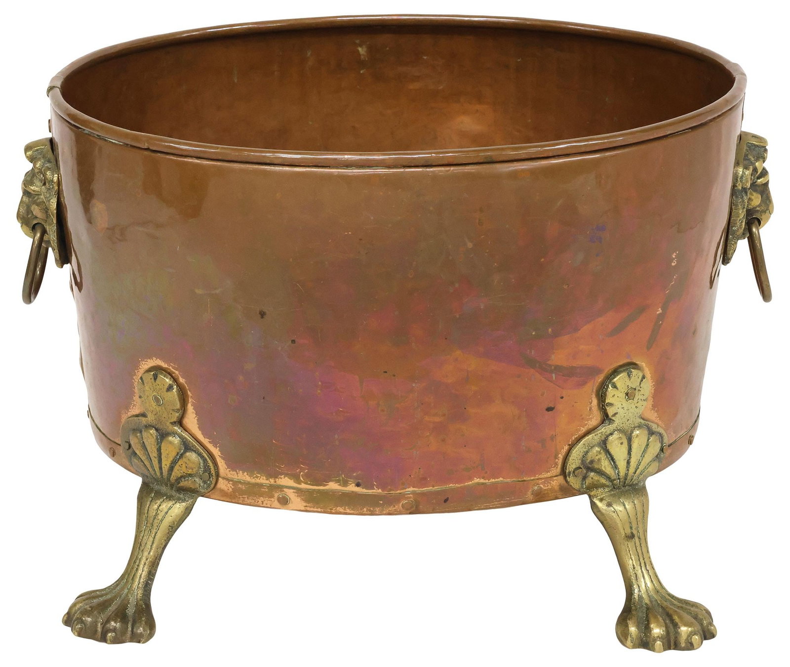 ENGLISH VICTORIAN COPPER & BRASS JARDINIERE / PLANTER ON PAW FEET: English Victorian brass and copper jardiniere/ planter, late 19th c., having ovular body, with dual lion mask drop ring handles, rising on paw feet, approx 12"h, 18.5"w, 14.25"d, 10lbs