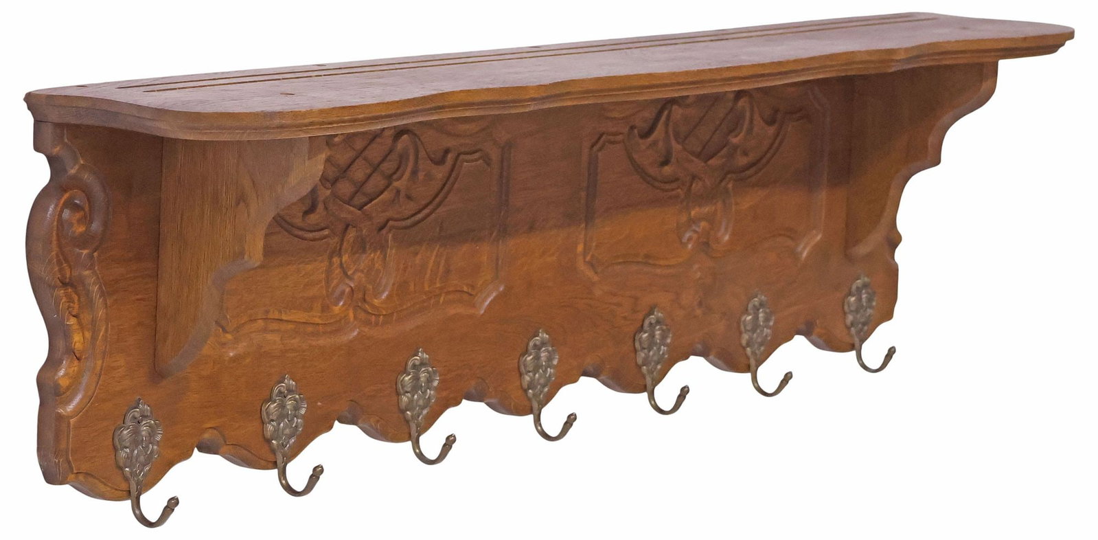 DUTCH CARVED OAK & BRASS WALL-MOUNTED COAT / HAT RACK: Dutch carved oak wall-mounted hall tree, early 20th c., shelf raised on scrolled corbels, over paneled back, issuing seven brass coat or hat hooks depicting pair of children, approx 12"h, 44"w, 7"d