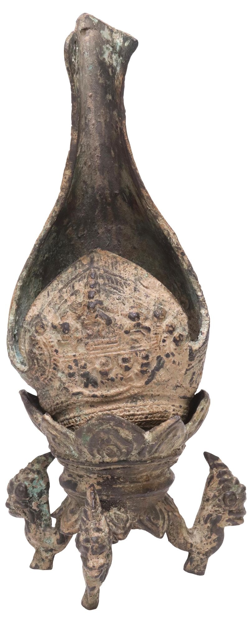 SOUTHEAST ASIAN CONCH-FORM RITUAL LIBATION VESSEL ON STAND, LIKELY KHMER: Southeast Asian Bayon style bronze ritual vessel on stand, likely Khmer, Cambodia, in the form of a conch shell, with cast figural scene depicting the dancing enlightenment deity, Hevajra, with devote