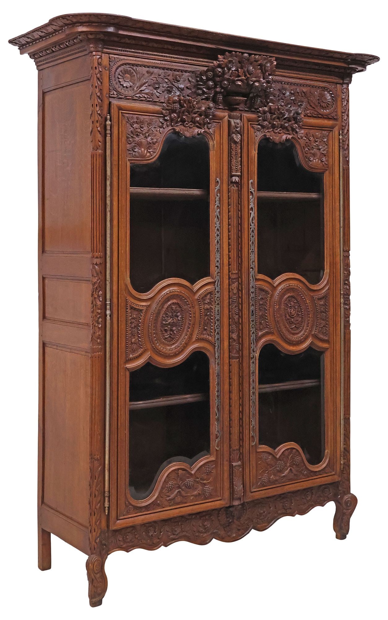 FRENCH PROVINCIAL LOUIS XV STYLE CARVED OAK WEDDING ARMOIRE / BOOKCASE: French Provincial Louis XV style oak wedding armoire, 19th c., now fashioned as a display cabinet or bookcase, having stepped cornice, above protruding flowering urn crest in high relief, dual cabinet