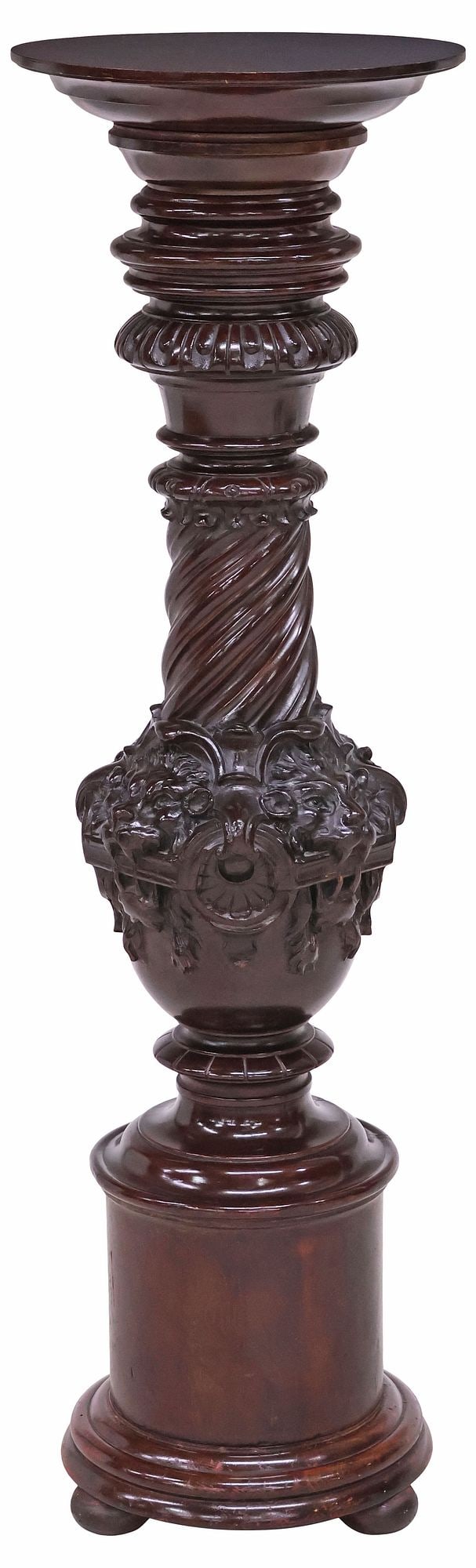 ITALIAN RENAISSANCE REVIVAL CARVED WALNUT PEDESTAL: Italian Renaissance Revival carved walnut pedestal, 20th c., having a circular top, over turned spiral standard with lion masks, ending in a circular molded base on bun feet, approx 46.75"h, 13.75"w, 