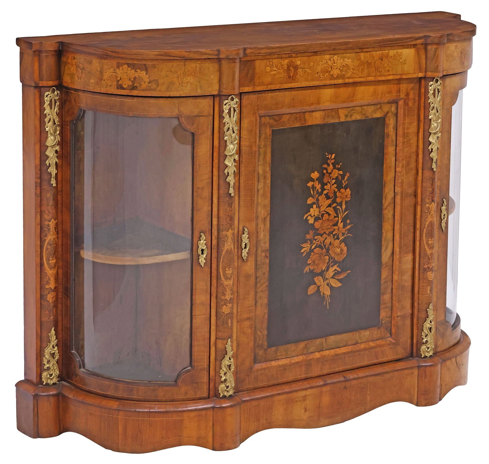 ENGLISH VICTORIAN MARQUETRY-INLAID WALNUT CREDENZA / SIDEBOARD: English Victorian figured walnut sideboard/ credenza, late 19th c., shaped case with inlaid floral spray marquetry, central parcel-ebonized door, flanked by gilt-metal mounts and glazed cabinet with s