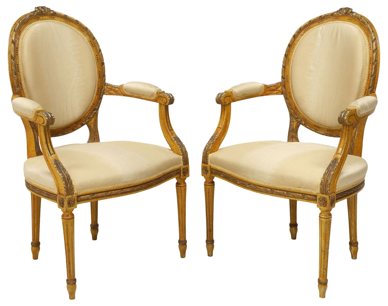 (2) FRENCH LOUIS XVI STYLE PARCEL-GILT & PAINTED ARMCHAIRS: (pair) French Louis XVI style paint-decorated armchairs, 20th c., in an intentionally distressed painted finish, with remnants of parcel-gilt accents, ribbon crest over padded back, seat, and arms in 