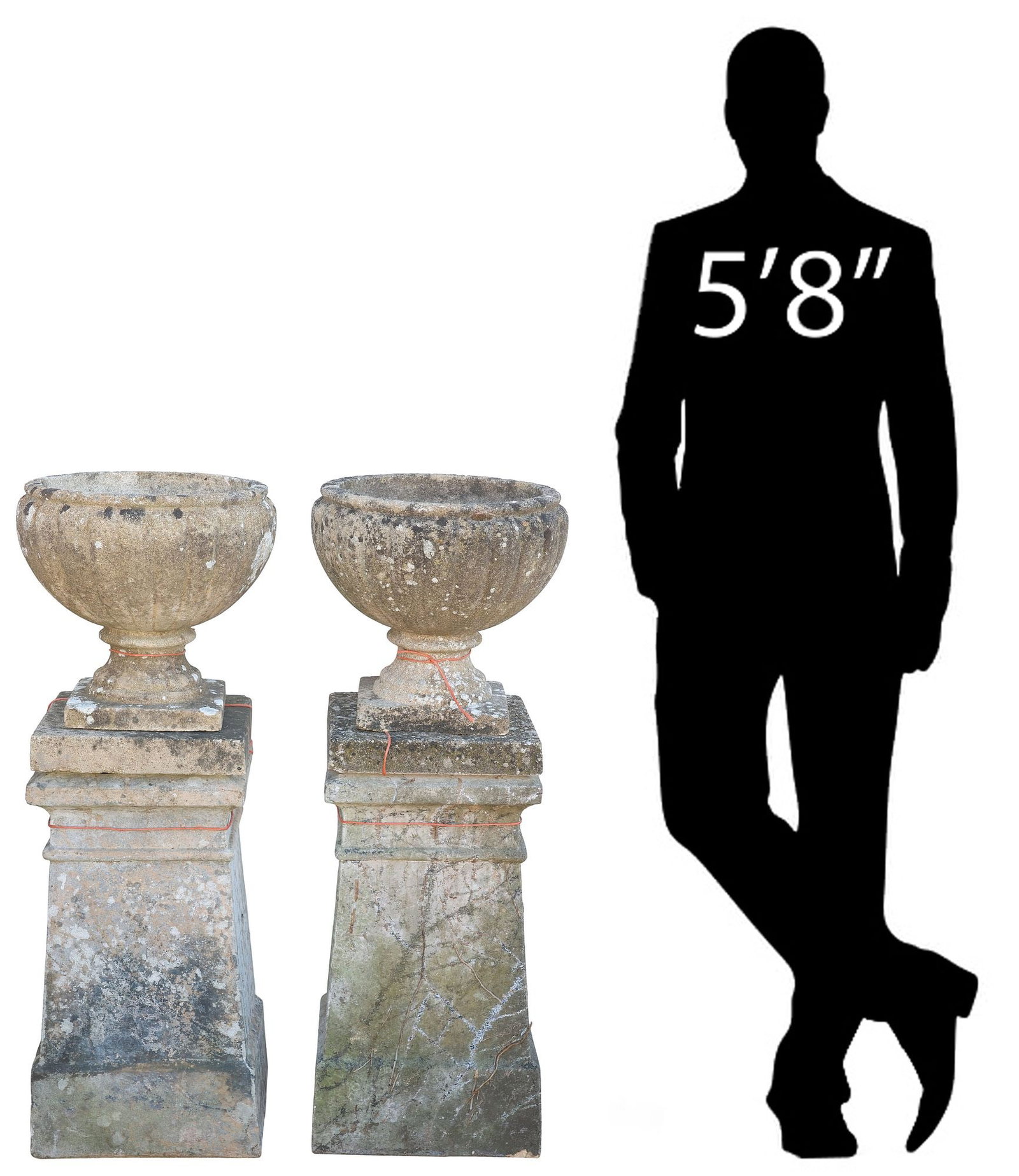(2) ENGLISH CAST STONE RIBBED GARDEN URNS ON PEDESTALS, 38.5"H: (pair) English cast stone garden urns on pedestals, each having tapering ribbed basin, rising on square base, further raised on rectangular plinth, each in three parts, one urn with chip to foot, over