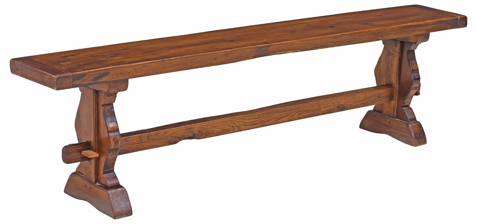 RUSTIC ITALIAN OAK TRESTLE BENCH: Rustic Italian oak bench, early 20th c., rectangular plank seat, raised on trestle supports, joined by mortise and tenon cross-stretcher, ending on molded bridge feet, approx 18"h, 67"w, 10&