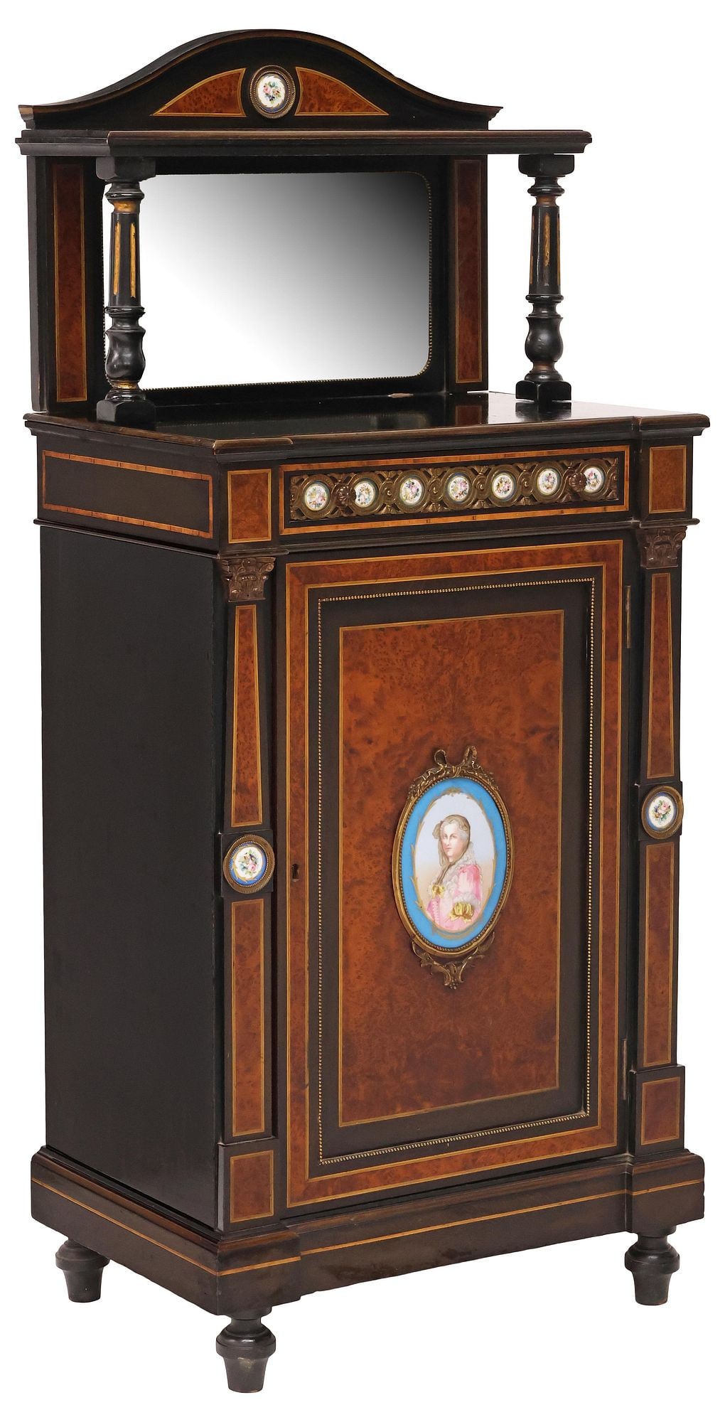 ENGLISH VICTORIAN PARCEL-EBONIZED & PORCELAIN-INSET BURLWOOD CABINET: English Victorian parcel-ebonized burlwood cabinet, late 19th c., having arched pediment with medial shelf on fluted columnar supports, over beveled mirror plate, lower cabinet with stringwork and ban