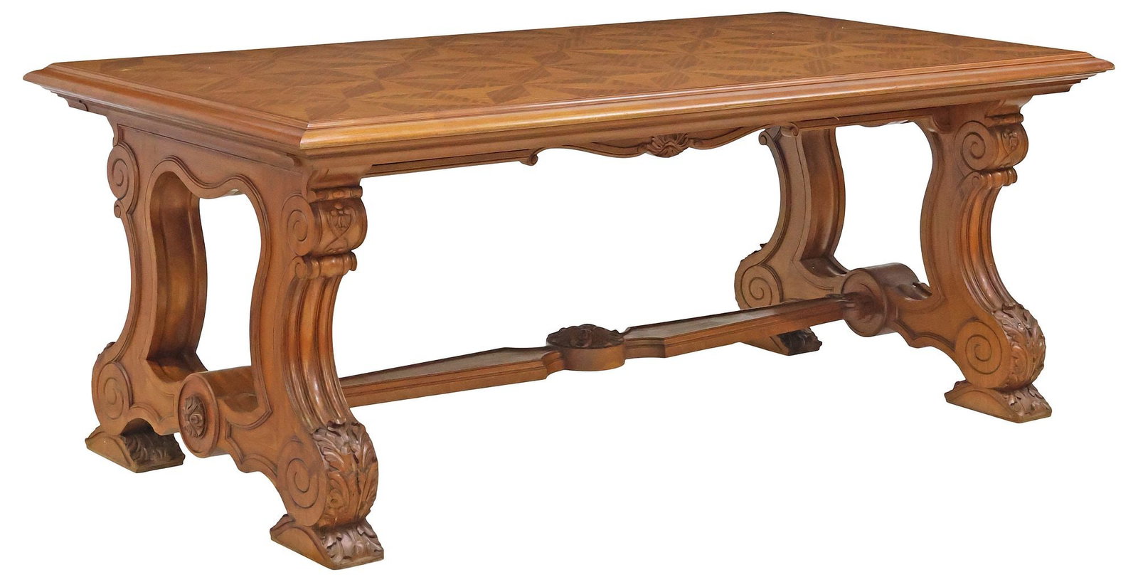FRENCH CARVED WALNUT & PARQUETRY LIBRARY EXTENSION TABLE: French carved walnut library extension table, 20th c., having stepped parquetry top, rising on scrolled trestle supports, joined by cross stretcher, ending on molded acanthus leaf feet, accompanied by