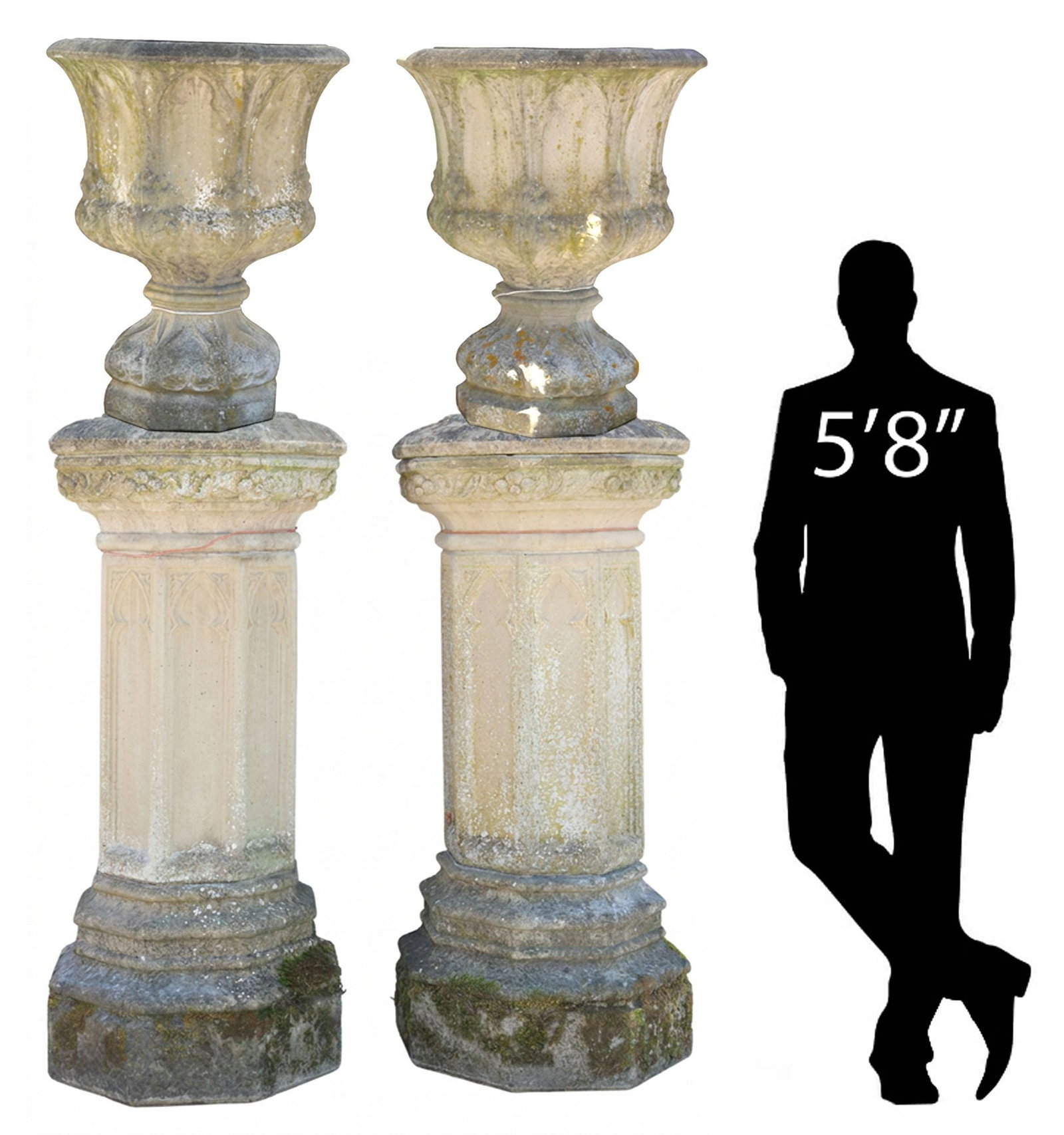 (2) MONUMENTAL GOTHIC STYLE CAST STONE GARDEN URNS ON PLINTHS, 94"H: (pair) Monumental English Gothic style cast stone garden urns on plinths, each of octagonal form, with tracery and scrolled foliate motifs, rising on pedestal base, further raised on stepped plinth, o