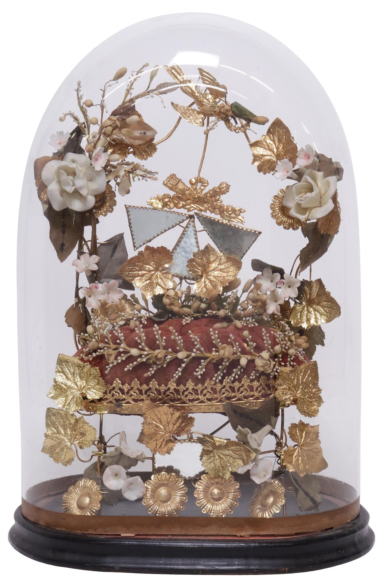 FRENCH GLOBE DE MARIEE / BRIDE'S GLOBE IN GLASS CLOCHE: French globe de mariee/ bride's globe, late 19th c., glass cloche/ dome on ebonized base, encasing porcelain flowers, small beveled mirror plates, and gilt-metal foliates, on tufted cushion, approx 15