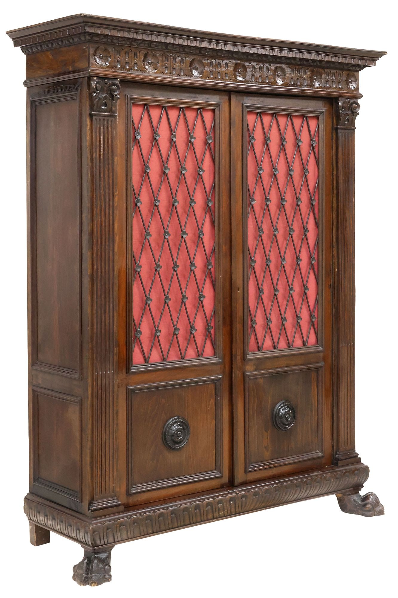 ITALIAN RENAISSANCE REVIVAL CARVED WALNUT & WROUGHT IRON BOOKCASE: Italian Renaissance Revival carved walnut bookcase, late 19th c., having molded cornice, over floral medallion frieze, fitted with pair of paneled cabinet doors with wrought iron latticework and fabri