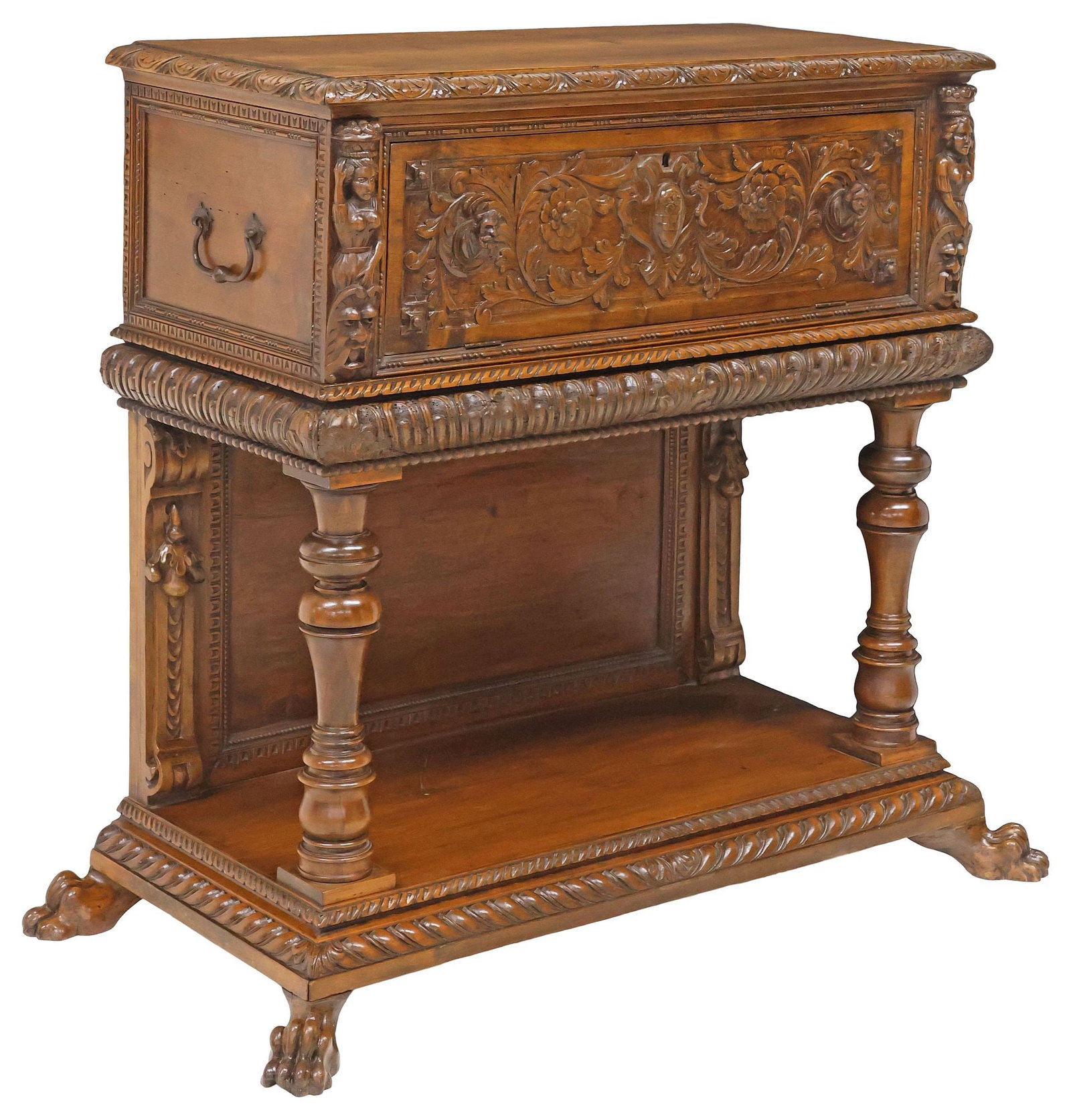 ITALIAN RENAISSANCE REVIVAL CARVED WALNUT FALL-FRONT COFFER ON STAND: Italian Renaissance Revival walnut storage chest on stand, 19th c., chest-form cabinet flanked by dual side handles, fall-front panel with carved foliated scrollwork and figural mask pulls in relief, 