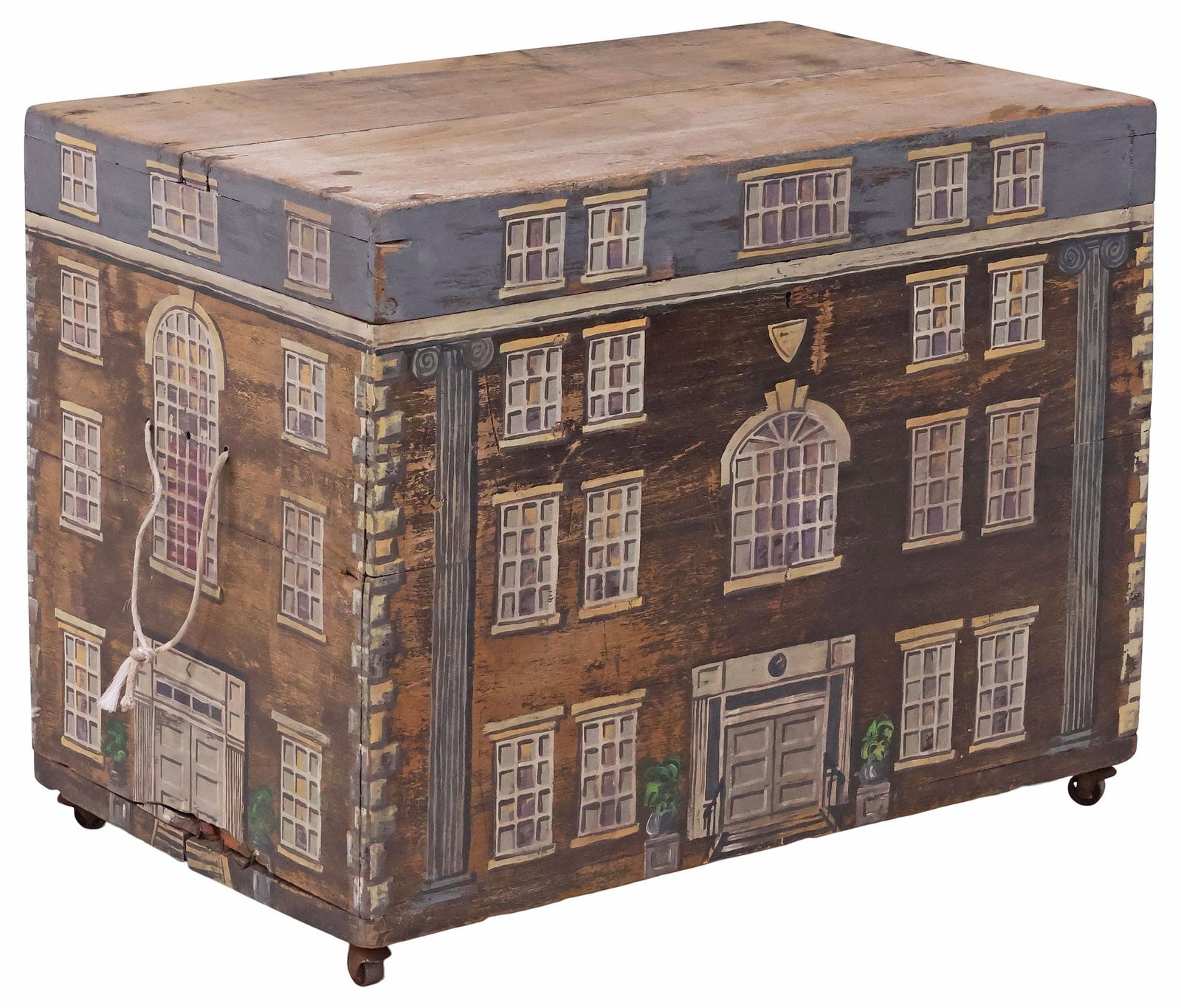 ENGLISH PAINT-DECORATED HOUSE FACADE BLANKET BOX / TRUNK: English paint-decorated pine blanket box or storage trunk, late 19th c., the exterior later painted as a Georgian style house facade, sides with corded rope handles, hinged lid revealing open interior
