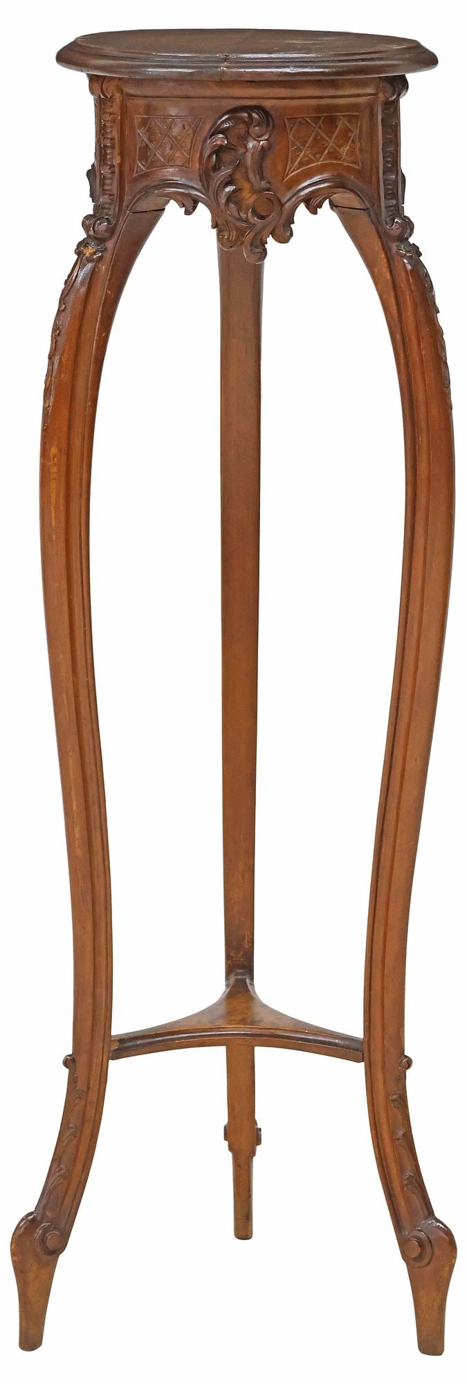 LOUIS XV STYLE CARVED WALNUT PEDESTAL / DISPLAY STAND: Louis XV style walnut pedestal/ display stand, early 20th c., having circular top, over apron with carved latticework and scrolling foliate motifs, rising on cabriole legs joined by medial shelf, endi