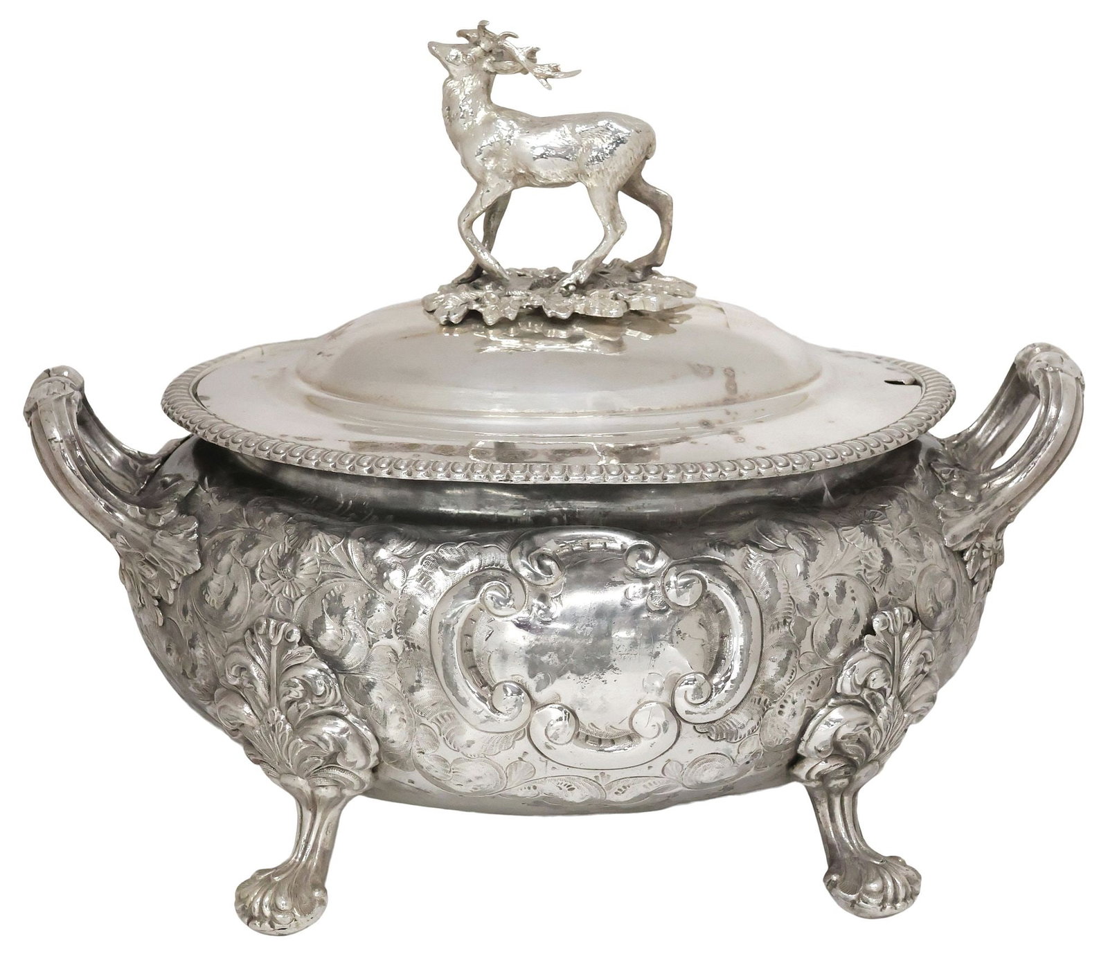 ENGLISH VICTORIAN SILVERPLATE STAG MOTIF SOUP TUREEN & COVER: English Victorian silverplate covered soup tureen, late 19th c., having domed lid with stag finial, over dual reeded handles, bulbous body with chased flowers and foliate scrollwork, centering two bla
