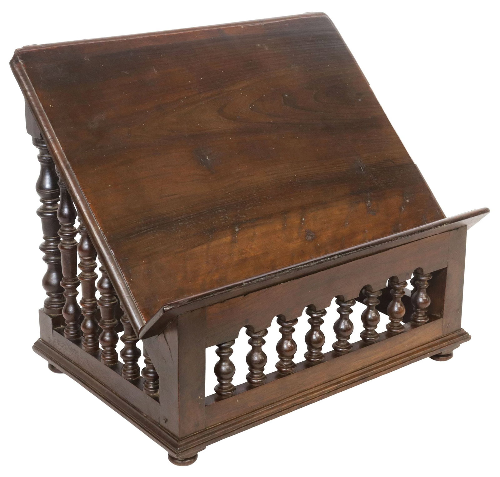 CONTINENTAL SPINDLED WALNUT TABLETOP LECTERN / BOOK STAND: Continental walnut tabletop lectern/ bookstand, 19th c., slanted edge, over spindled base, rising on bun feet, loss to one foot, approx 12 3/8"h, 15"w, 11.25"d, 5.25lbs