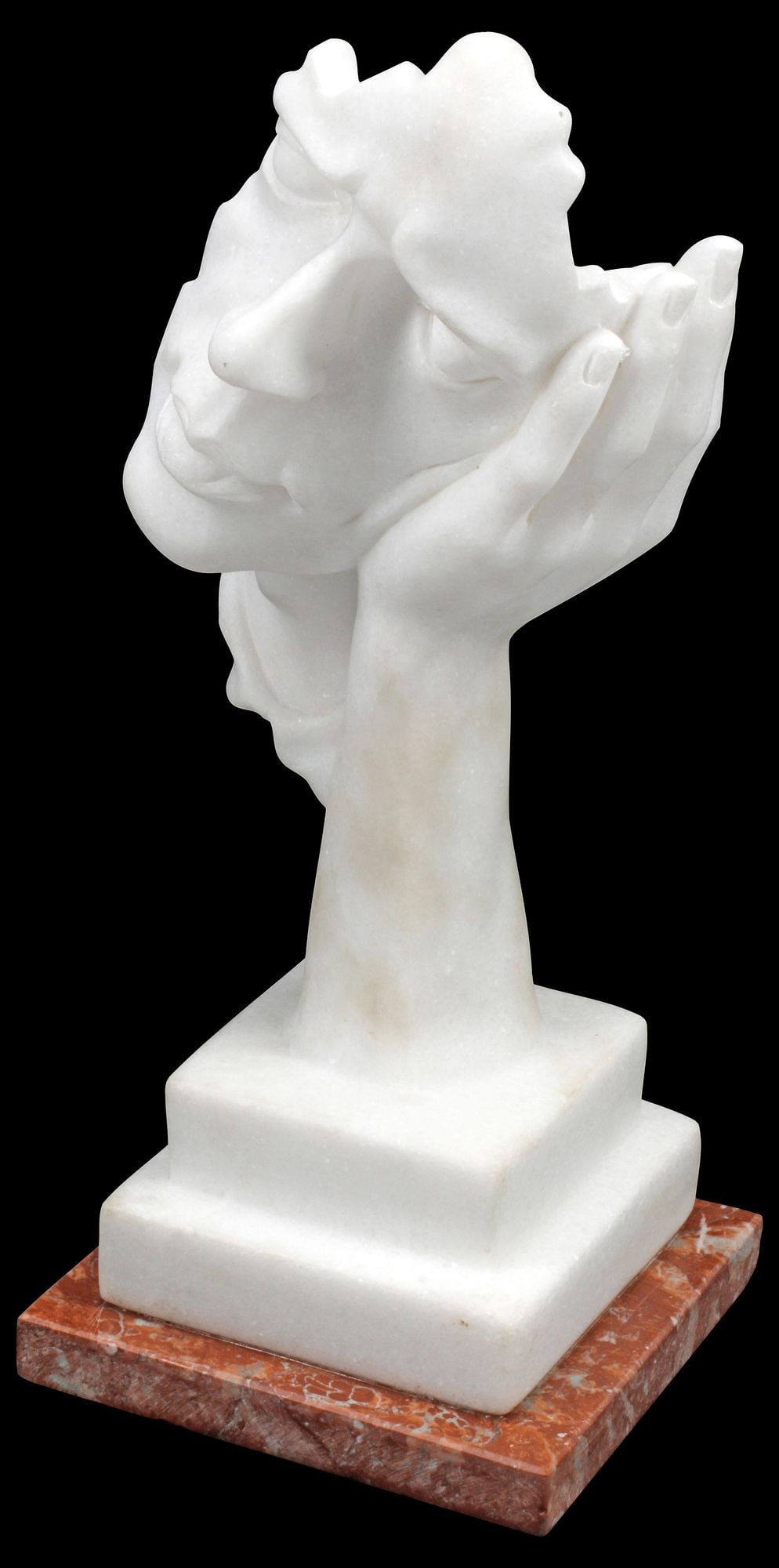 MODERNIST CARVED WHITE MARBLE SCULPTURE, HELD REVERIE: Modernist carved white marble sculpture, Held Reverie, modeled as a partial human head resting in open palm, on integral stepped platform and rouge marble base, approx 14"h, 6"w, 6"d, 12lbs