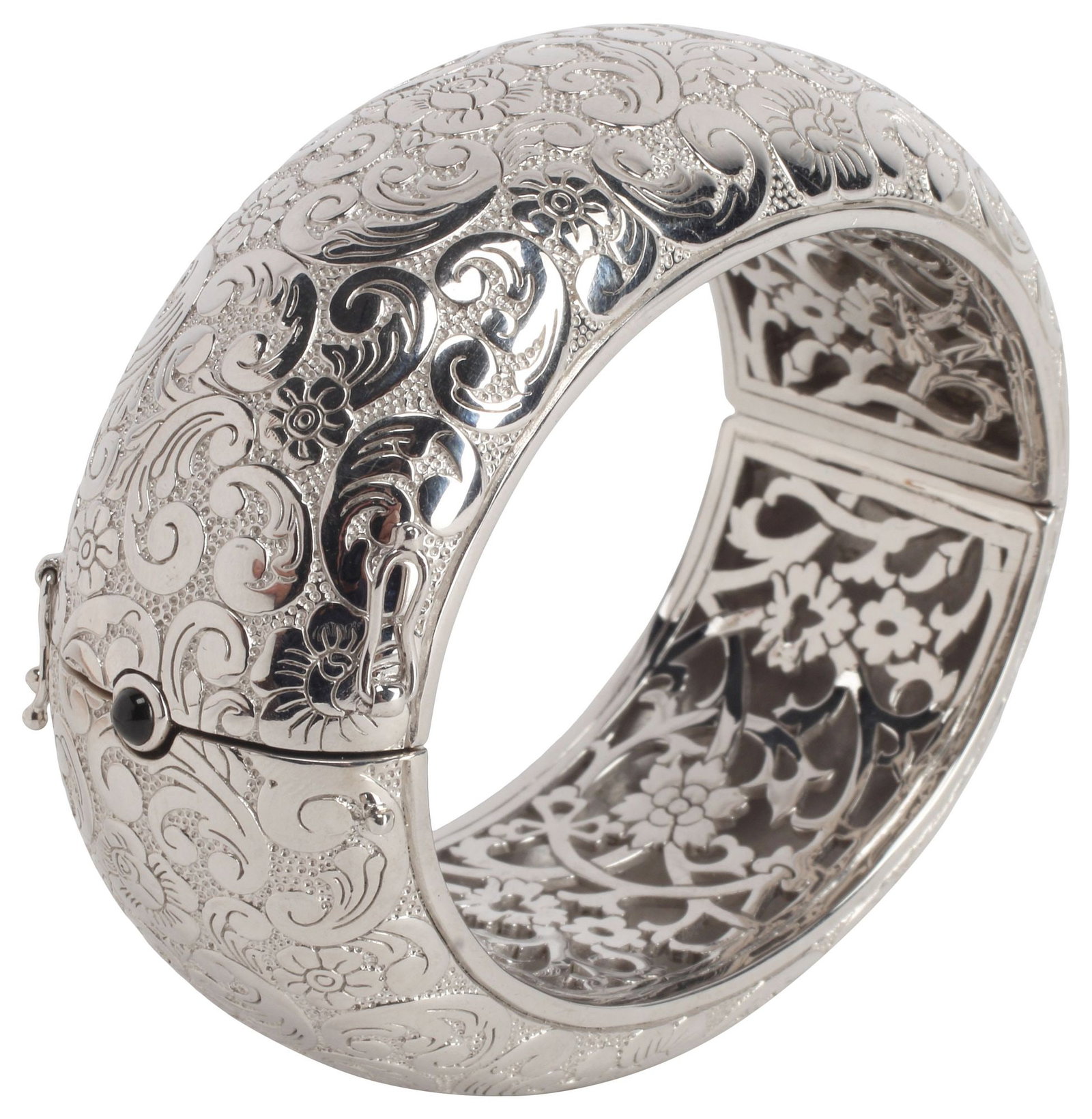 DESIGNER MONICA RICH KOSANN STERLING SILVER FOLIATED BANGLE BRACELET: Heavy designer estate sterling silver hinged bangle bracelet, Monica Rich Kosann, engraved with floral and foliate scrolls, pierced design at the interior, box clasp with cabochon black onyx push piec