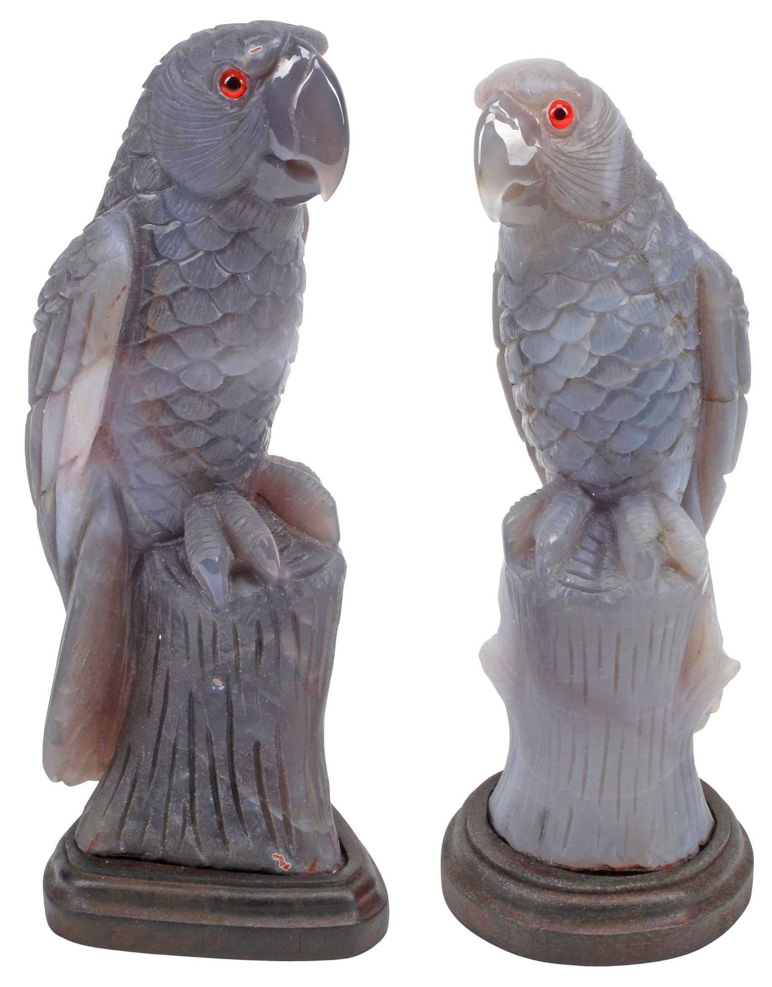 (2) CARVED AGATE SCULPTURES OF PARROTS ON WOOD BASES: (lot of 2) Carved agate sculptures, Perched Parrots, each with inset eyes, seated atop tree stump-shaped pedestal, rising on wood base, largest overall: approx 11"h, 4"w, 4.5"d, 9.5lbs total