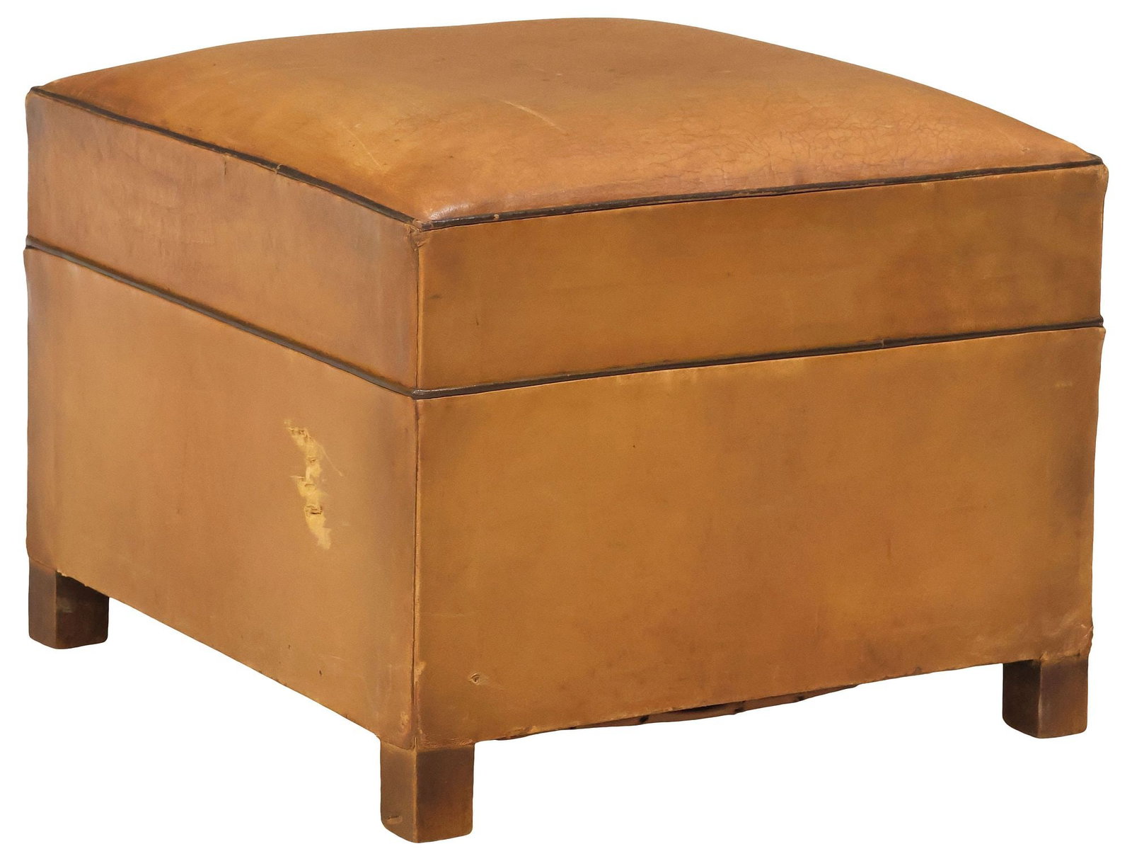 FRENCH ART DECO PERIOD TAN LEATHER OTTOMAN / FOOTSTOOL: French Art Deco ottoman/ footstool, c.1930s, in a tan leather upholstery with contrasted piping, on wood block feet, small hole within area of peeling at side, approx 15.25"h, 19"w, 19"d