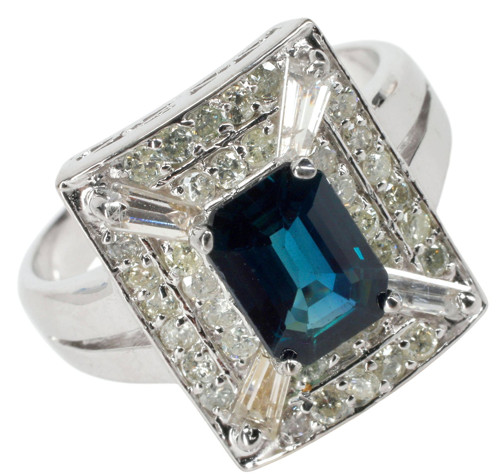 ESTATE 14KT WHITE GOLD 1.23CT BLUE SAPPHIRE & 1.10CTTW DIAMOND RING: Estate 14kt white gold, diamond, and sapphire ring, central emerald cut sapphire, approx 1.23cts, in a surround of baguette and round diamonds, approx 1.10cttw, average color: H-I, average clarity: