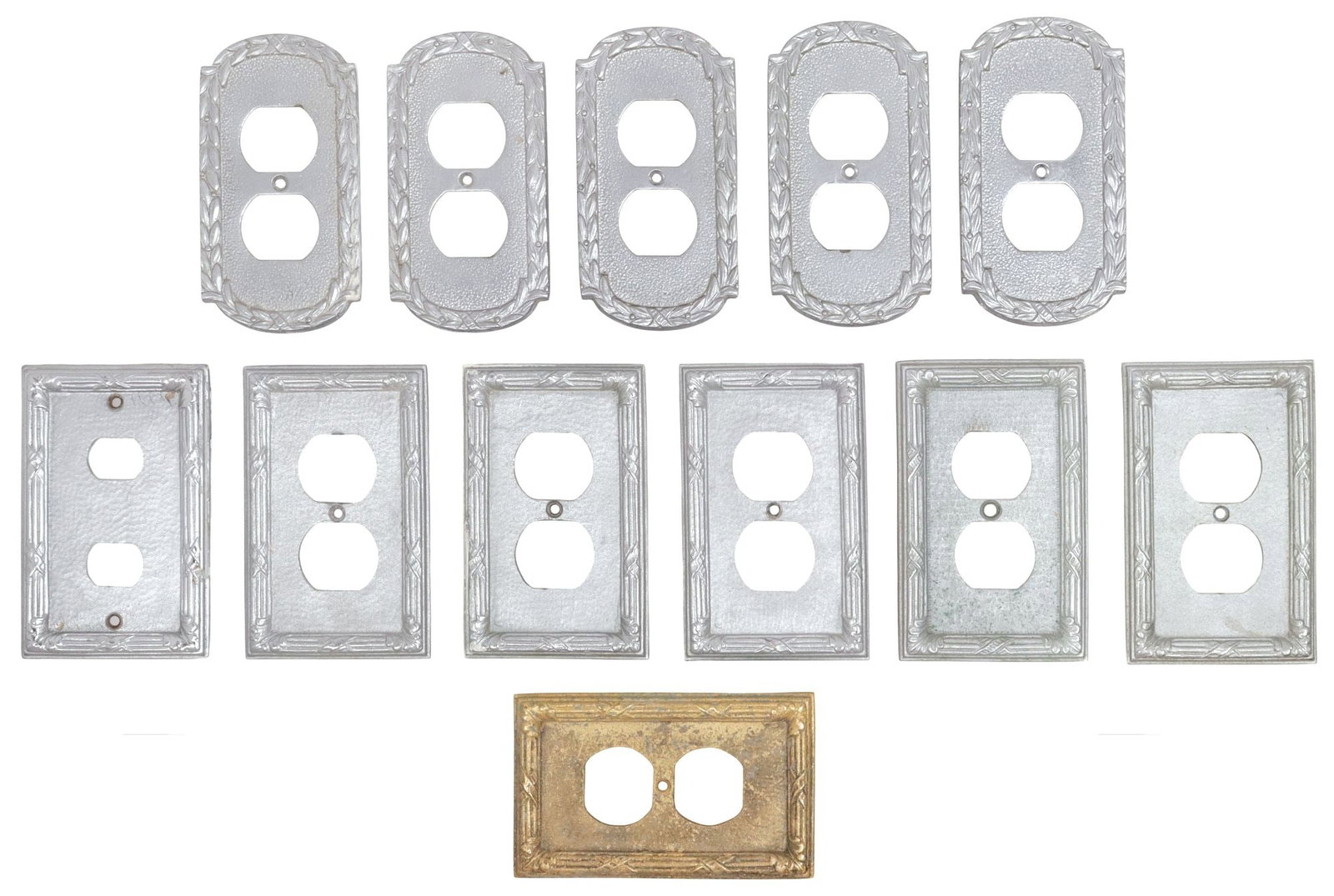 (12) DESIGNER SHERLE WAGNER (ATTRIB.) DUPLEX OUTLET COVERS, VARIOUS PATTERNS: (lot of 12) Designer silver-toned metal duplex outlet covers, attributed to Sherle Wagner International, 20th c., varied patterns and shapes, including: (5) in an early rendition of the "Acanthus