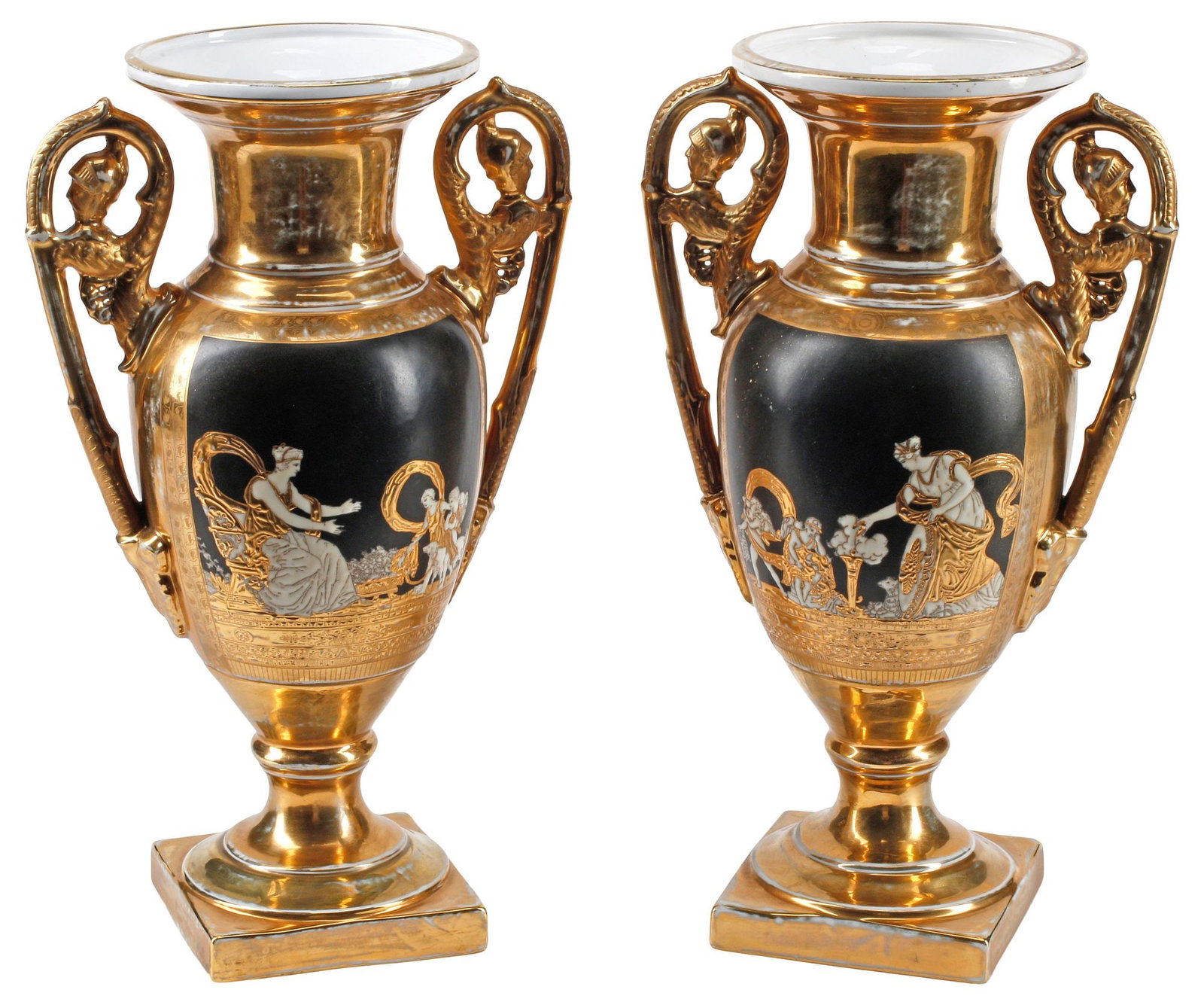 (2) BERLIN-STYLE PARCEL-GILT PORCELAIN MYTHOLOGICAL VASES: (pair) Berlin-style parcel gilt porcelain vases, each having dual scrolled handles, reserves depicting figural mythological scenes, rising on integral socle, spurious K.P.M. style mark underfoot, appr