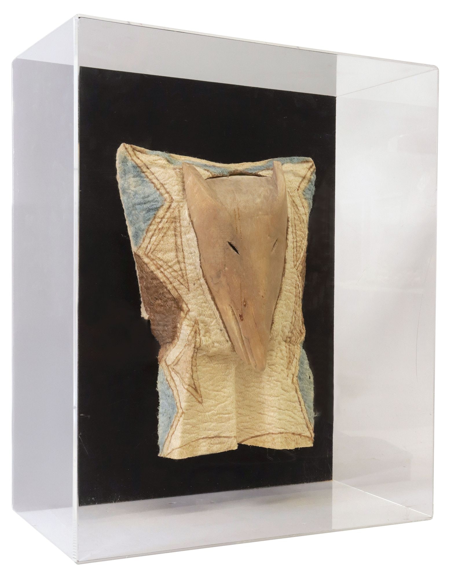 SOUTH AMERICAN CARVED WOOD TRIBAL MASK IN ACRYLIC CASE, LIKELY TICUNA: Large cased ceremonial mask, likely Ticuna Peoples, Amazon Basin, South America, carved wood animal mask with pointed ears and elongated face, diagonal slits for eyes, with dyed fabric head cover, hou
