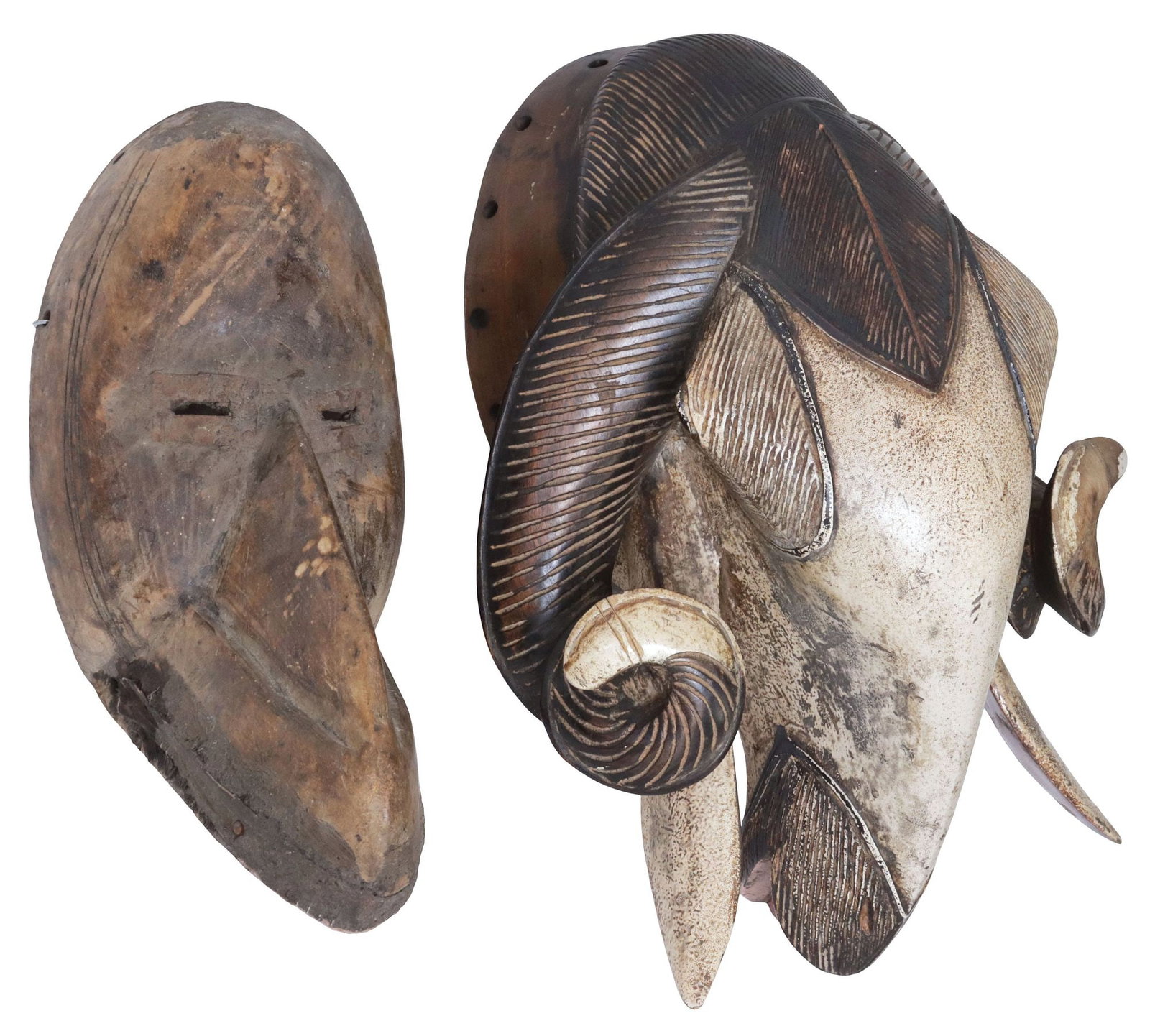 (2) LARGE WEST AFRICAN CARVED WOOD TRIBAL MASKS, BIRD & RAM: (lot of 2) West African carved wood tribal masks, including: (1) likely Baule or Baoule peoples, Ivory Coast/ Ghana, modeled as a paint-decorated ram's head, with spiral horns, framing open mouth, app