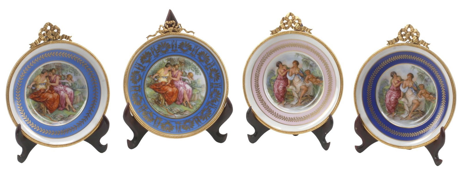 (4) FRENCH LIMOGES PORCELAIN & ORMOLU MOUNTED CABINET PLATES: French hand-painted porcelain cabinet plates, Limoges, each having bronze dore ribboned crest and surround, parcel gilt and colored borders, centering various allegorical scenes in reserve, marked dec