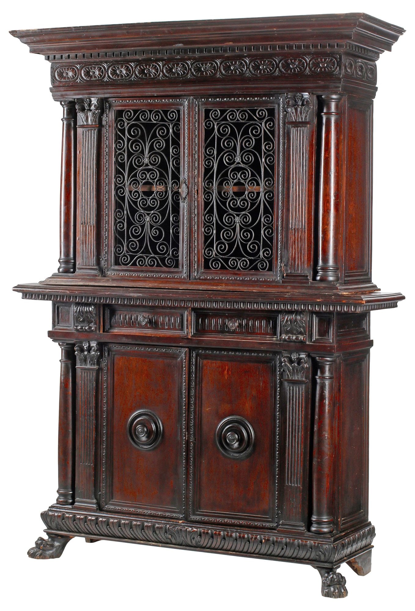 ITALIAN RENAISSANCE REVIVAL CARVED WALNUT & WROUGHT IRON CABINET: Italian Renaissance Revival carved walnut cabinet, late 19th c., molded cornice with dentil trim, above pair of doors with scrolled wrought iron paneling, lower case fitted with two drawers, and two