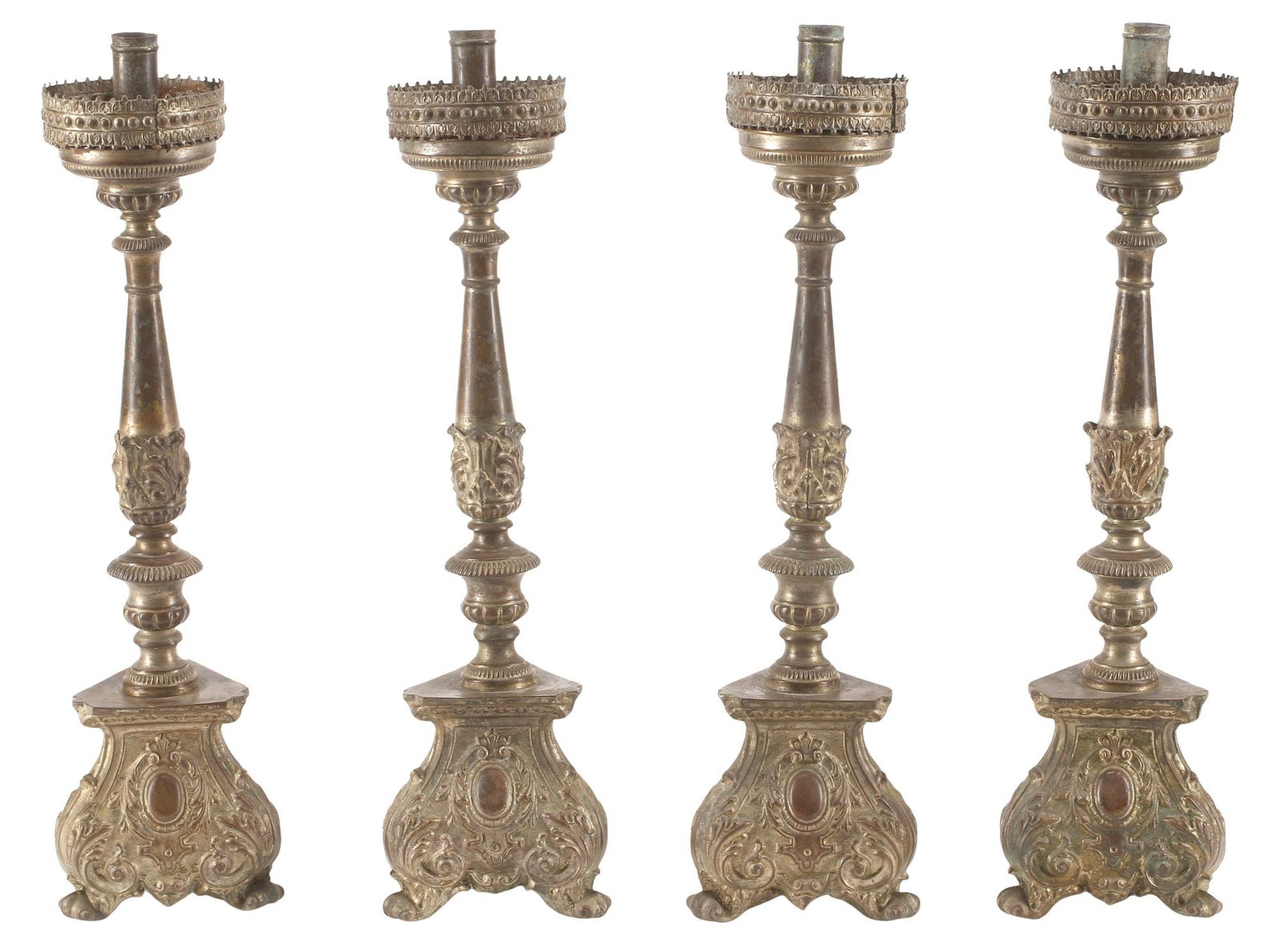 (4) ITALIAN BAROQUE STYLE PATINATED METAL CANDLESTICKS: (lot of 4) Italian Baroque style patinated metal candlesticks, 19th c., each having beaded bobeche, above turned-form standard, rising on tripartite base with repousse foliate scrollwork, approx 18.5"
