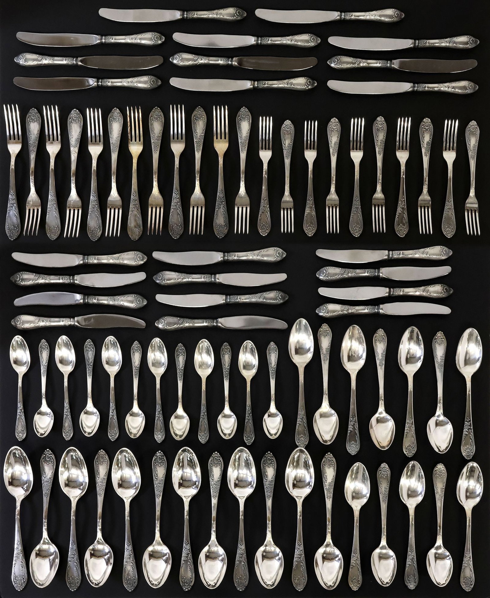 (81) RUSSIAN SOVIET UNION SILVERPLATE FLATWARE SERVICE IN FITTED BOX: (lot of 81) Russian Soviet Union silverplate flatware service, likely Shevchenko Factory, each having rocaille scrollwork and foliate motifs, marked in Cyrillic script, no observed monograms, includin