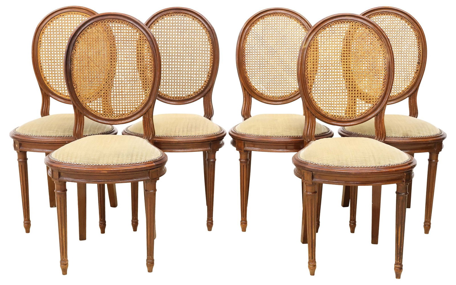 (6) FRENCH LOUIS XVI STYLE CANED & UPHOLSTERED WALNUT DINING CHAIRS: (lot of 6) French Louis XVI style caned mahogany dining chairs, early 20th c., each with oval medallion back and upholstered seat, on tapering fluted legs, ending on arrow feet, approx 38"h, 17.75"w,
