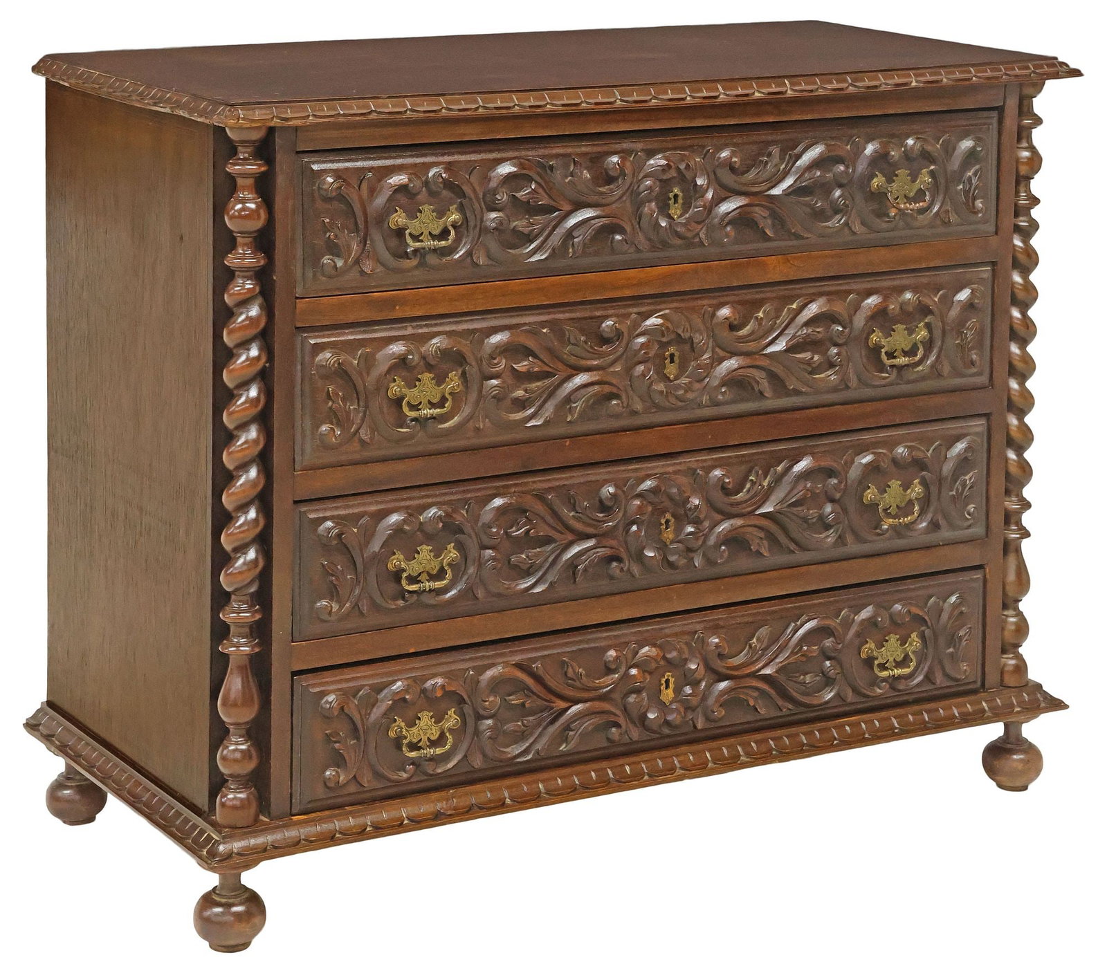 FRENCH HENRI II STYLE CARVED WALNUT SPIRAL TWIST COMMODE: French Henri II style walnut commode, 20th c., rectangular top with scalloped trim, over four drawers with scrolling foliates in relief, flanked by spiral twist posts, rising on bun feet, approx 34.5"