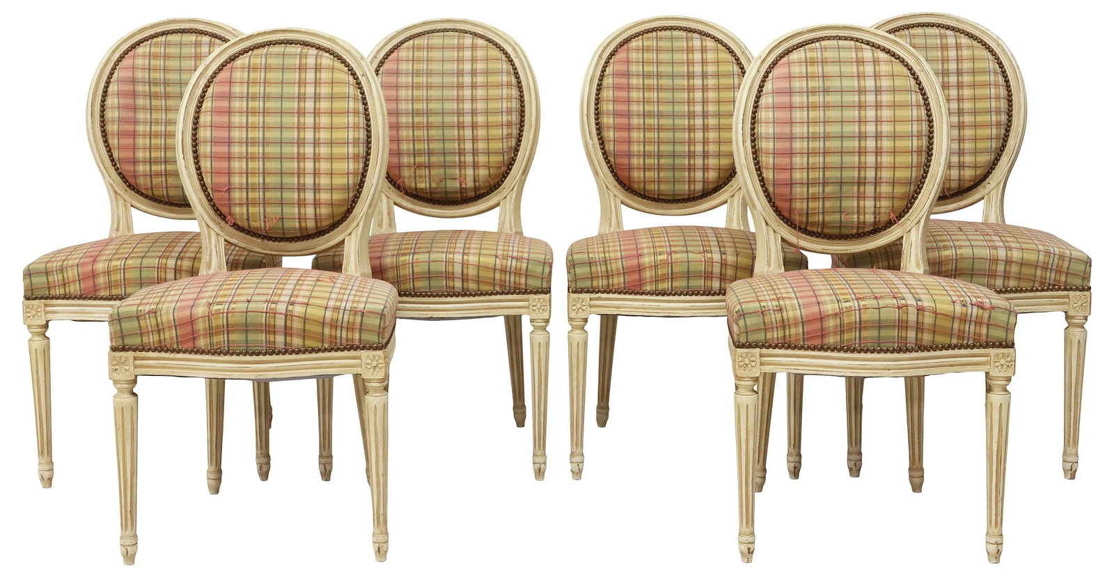 (6) FRENCH LOUIS XVI STYLE UPHOLSTERED & PAINTED DINING CHAIRS: (lot of 6) French Louis XVI style side chairs, early 20th c., each in a distressed white-painted finish, oval medallion backs and padded seats in worn plaid fabric upholstery, rising on tapering flute