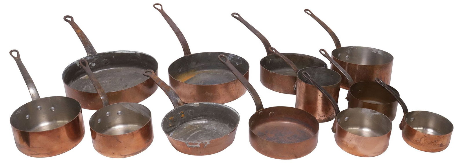 (12) RUSTIC FRENCH COPPER & METAL SAUCEPANS & SHALLOW PANS: (lot of 12) Rustic French copper saucepans and shallow pans, each with cast iron handle, (one) marked Couet to side, largest: approx 6.25"h, 12.5"w, 12"d, smallest: approx 5"h, 4 7/8"w, 9.5"d, 29.5lbs