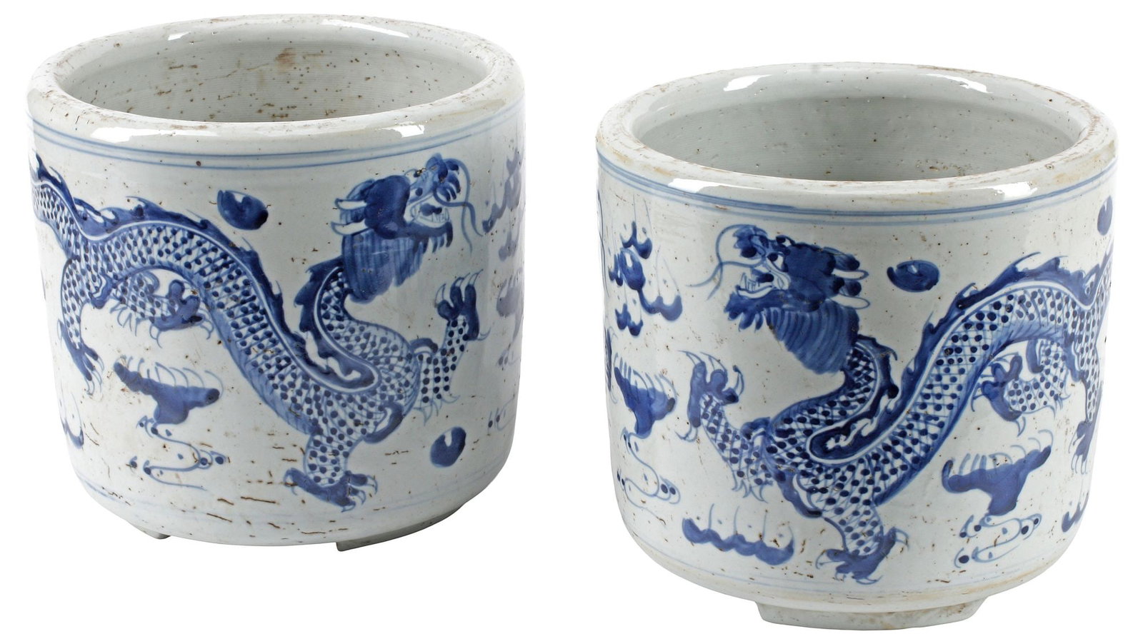 (2) CHINESE BLUE & WHITE PORCELAIN DRAGON MOTIF CACHEPOTS: (pair) Chinese blue and white porcelain cachepots, each with dragons and cloud motifs, character mark underfoot, approx 9"h, 10"diam, 24lbs total