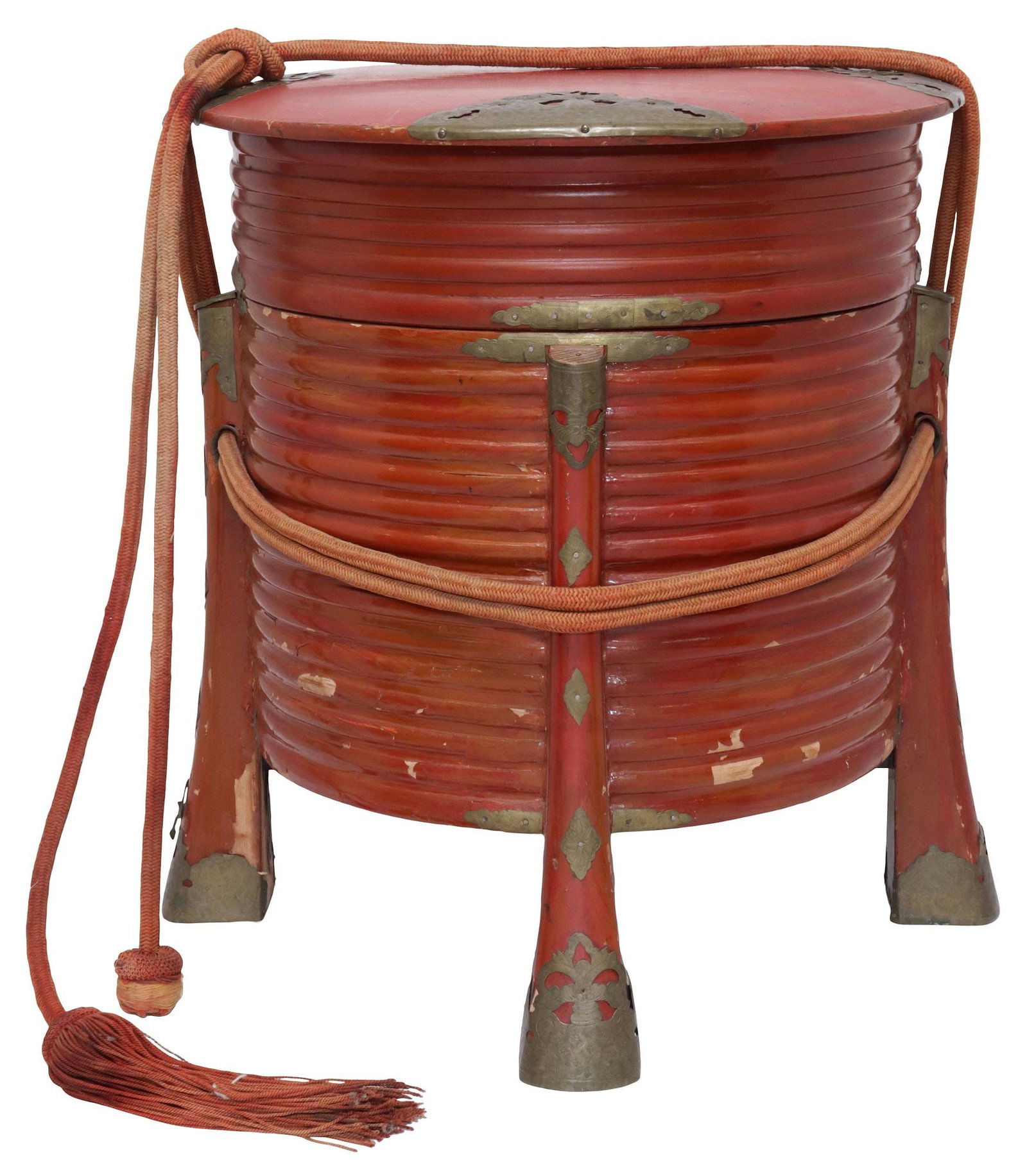 LARGE JAPANESE BRASS-BOUND RED LACQUER HOKAI BOX: Japanese red lacquer hokai container, of tall cylindrical form with reeded exterior, bound with pierced brass mounts, corded carrying straps, raised on flared legs, approx 17.25"h, 15"diam, 7.5lbs **P