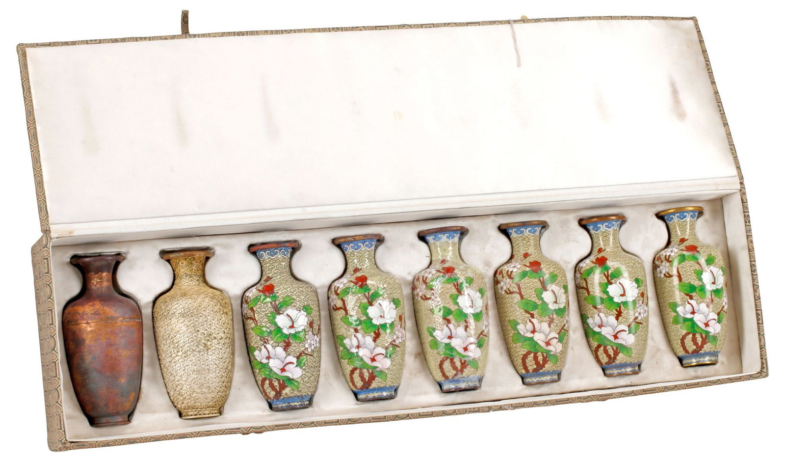 (8) CHINESE CLOISONNE ENAMEL VASE MANUFACTURING PROCESS SAMPLER SET: (lot of 8) Chinese cloisonne enamel process sampler set, illustrating the progressive stages of manufacture for a diminutive vase, the final product with flowering branches on scrolled ground, housed 