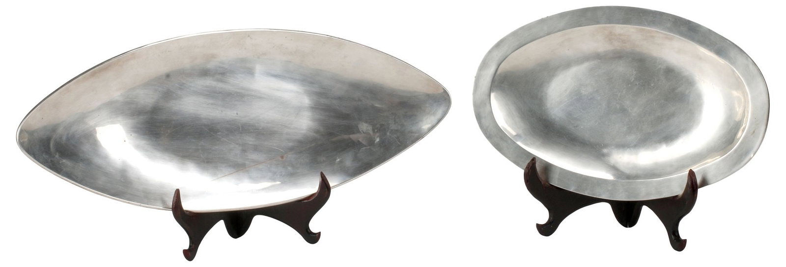(2) MEXICO MODERNIST STERLING SILVER SERVING PLATTERS, 39.22OZT: (lot of 2) Modernist sterling silver serving platters, Mexico, each marked Mexico sterling 925 underfoot, including: (1) of elongated navette form, marked VA, approx 19"l, 7.75"w; (1) of ovular form, 