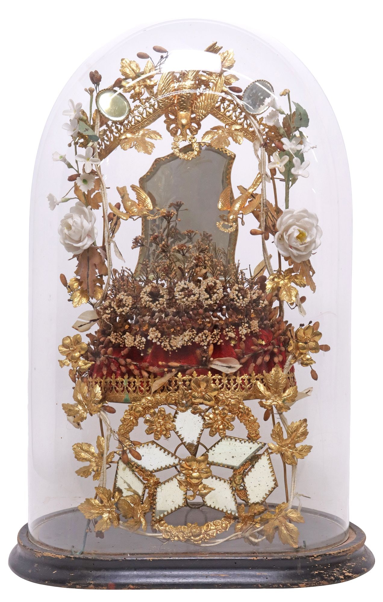 FRENCH GLOBE DE MARIEE / BRIDE'S GLOBE IN GLASS CLOCHE: French globe de mariee/ bride's globe, late 19th c., glass cloche/ dome on ebonized base, enclosing gilt metal frame, with silk and porcelain flowers, among small beveled mirror plates, over tufted cu